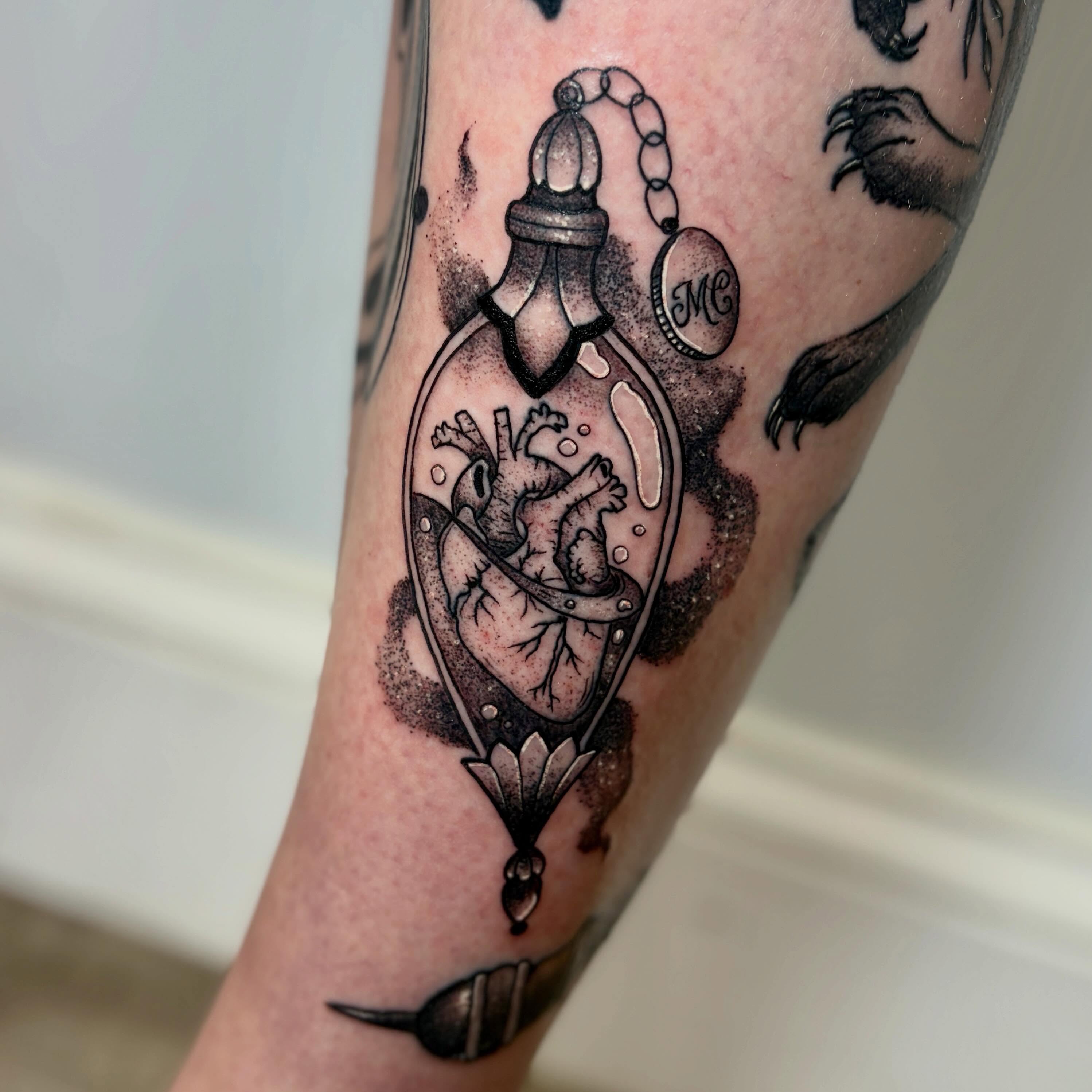 Heart in bottle dotwork tattoo on the forearm by Zeninkz