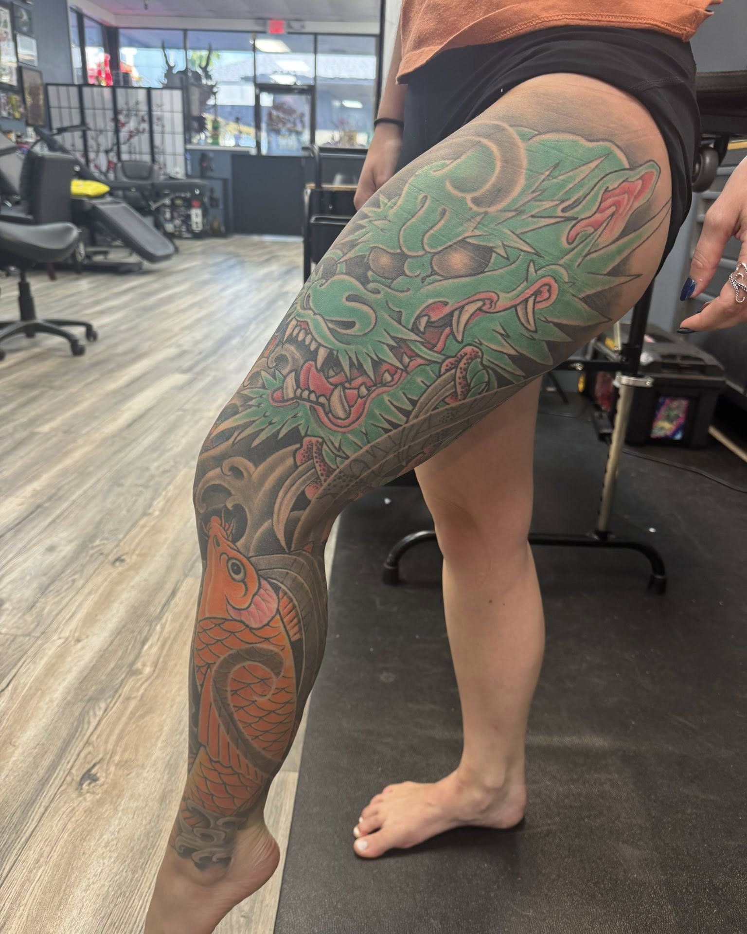 Dragon and koi fish japanese irezumi tattoo on the thigh by Dave Robinowitz