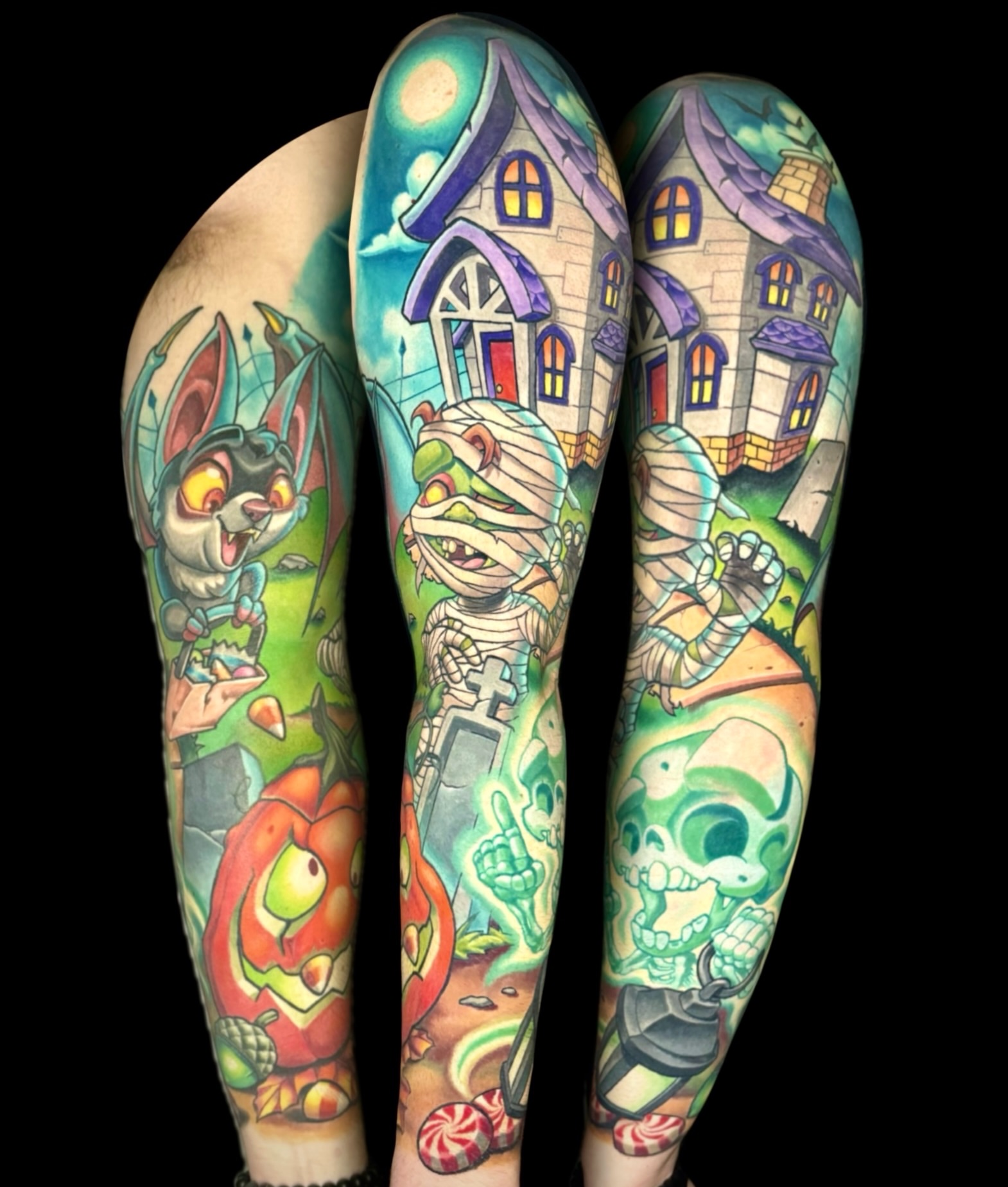 Haunted house and Halloween characters new school tattoo on the forearm by Kevin Boudreau Newschool Tattoos
