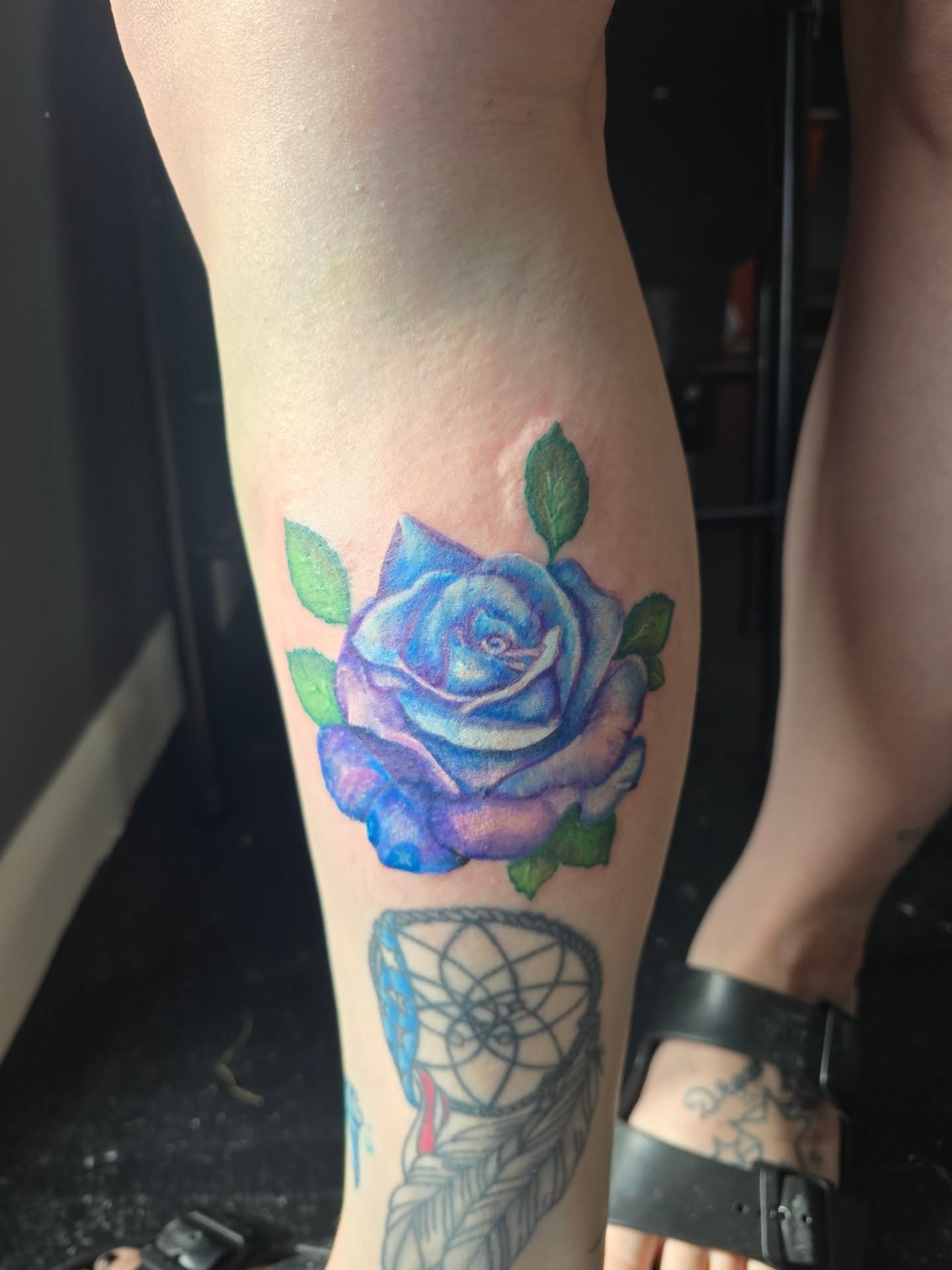 Blue rose watercolor tattoo on the forearm by Maddox Kitson🕷