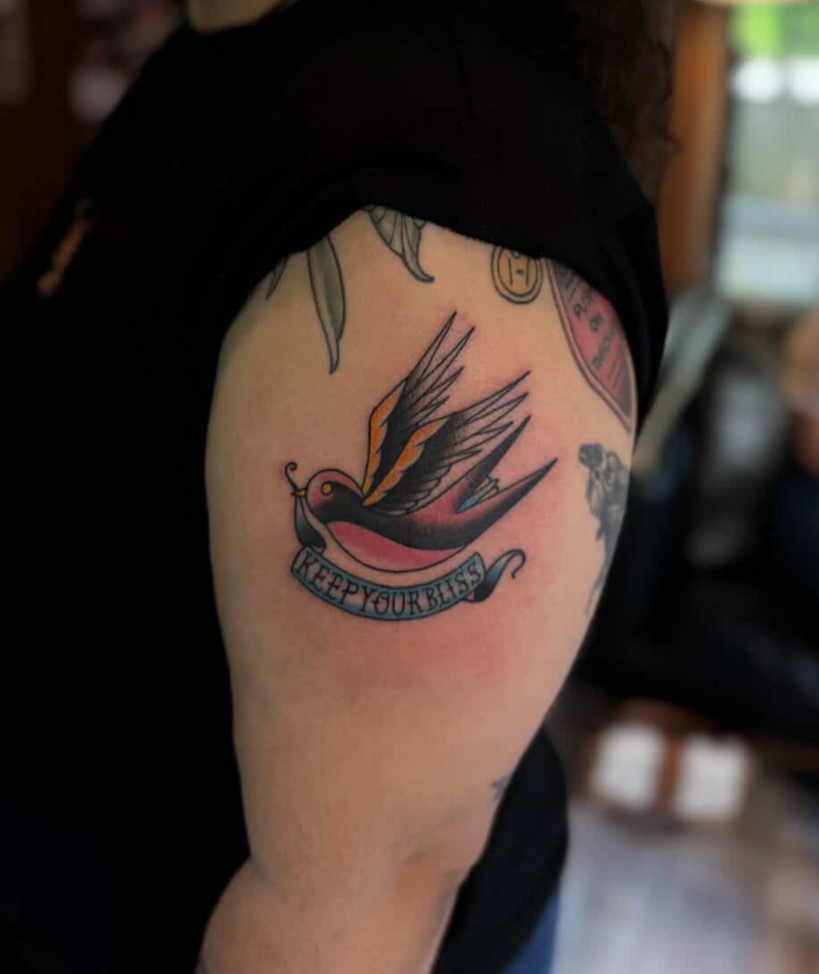 Swallow bird American traditional tattoo on the shoulder by Tori Magill