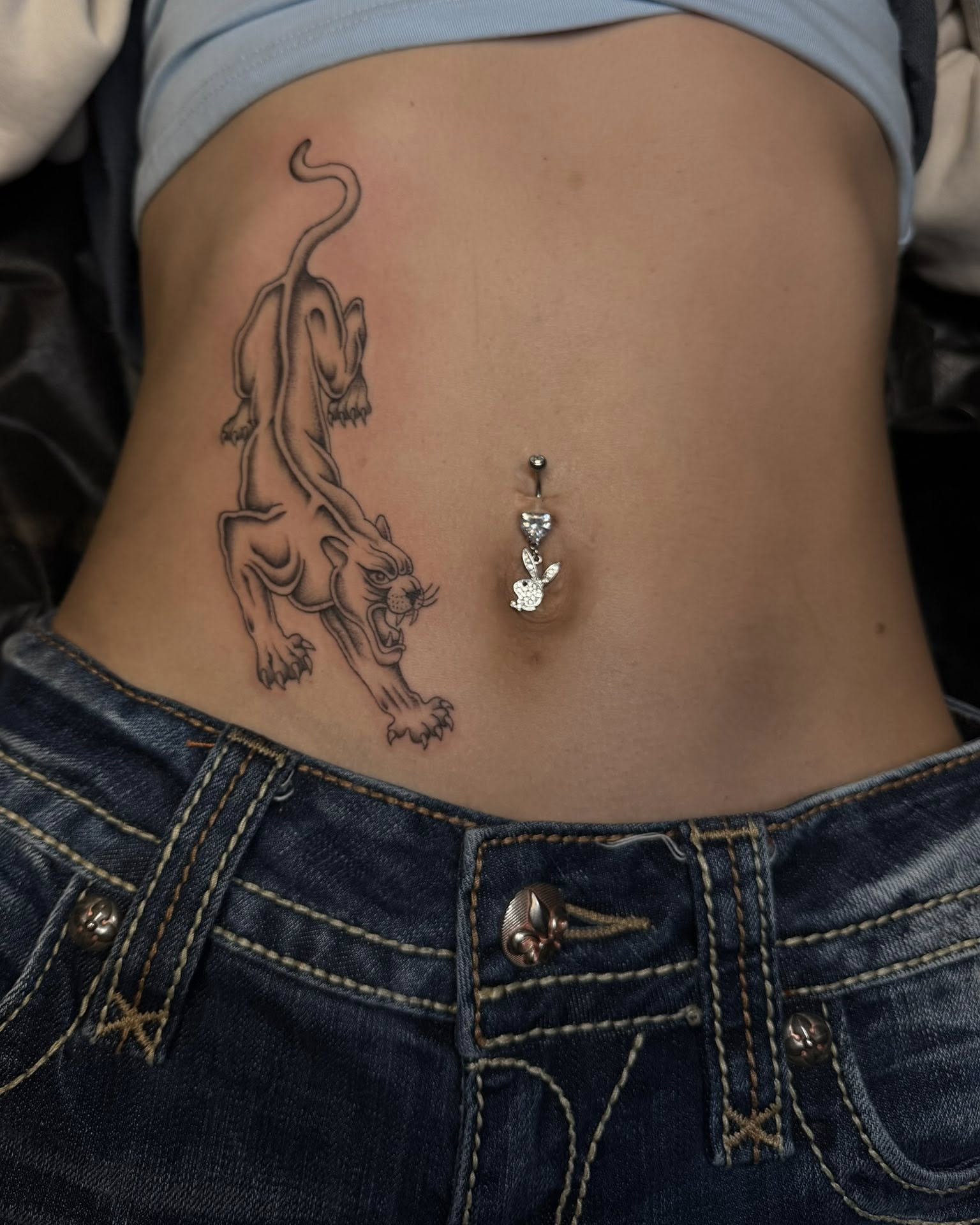 Panther black and grey tattoo on the torso by Madison Jasso