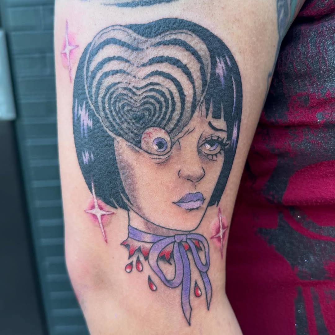 Heart-shaped hair surrealism tattoo on the forearm by Harley, Denver, Colorado