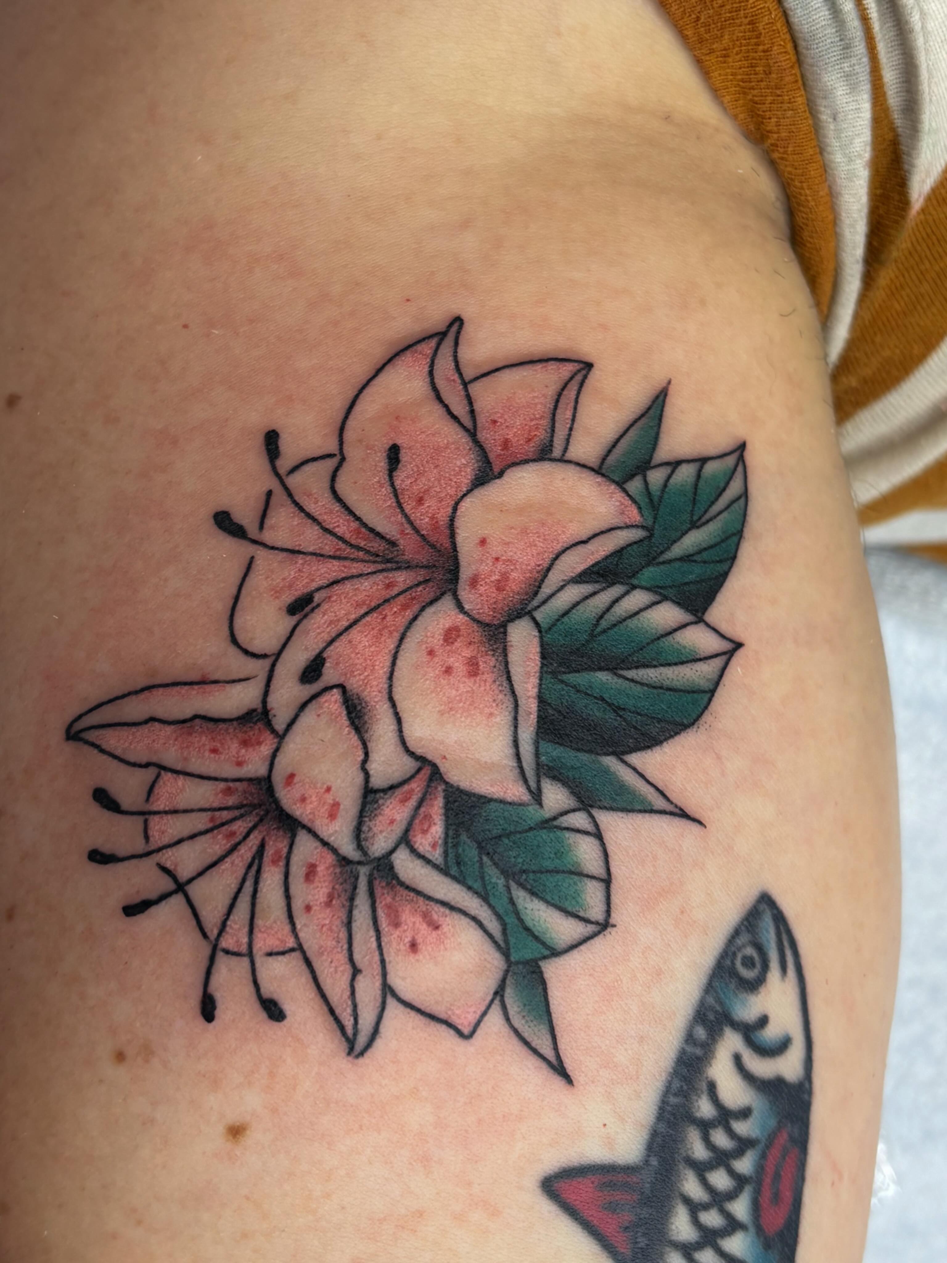 Lily American traditional tattoo on the shoulder by Evan Bisso, Philadelphia, Pennsylvania