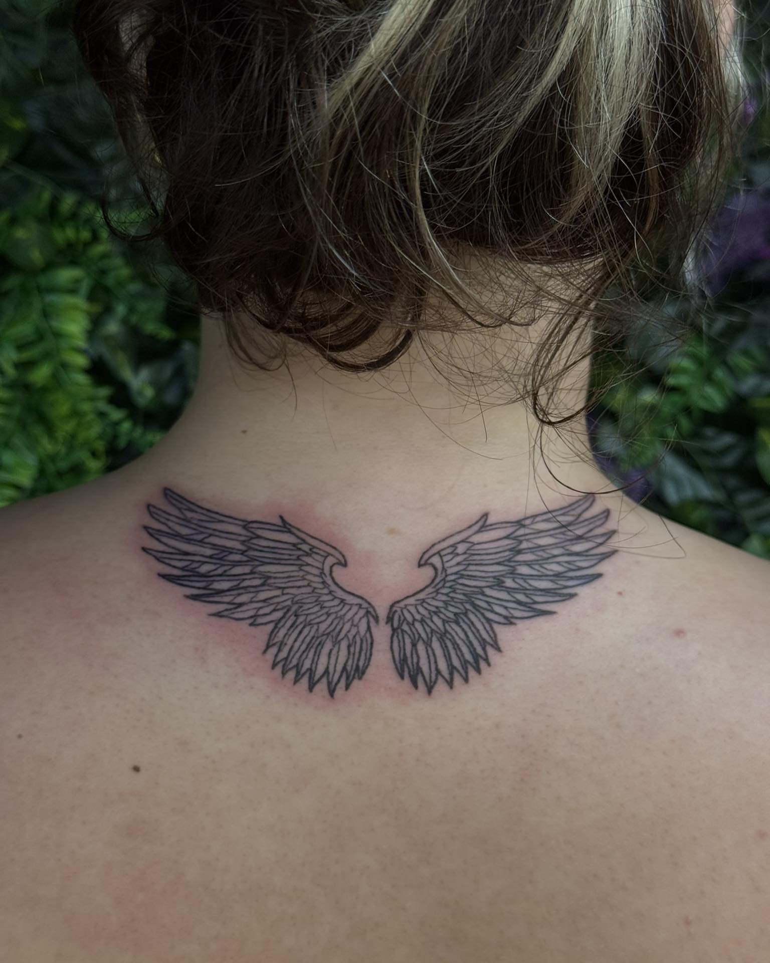 Wings black and grey tattoo on the back by Sabrina