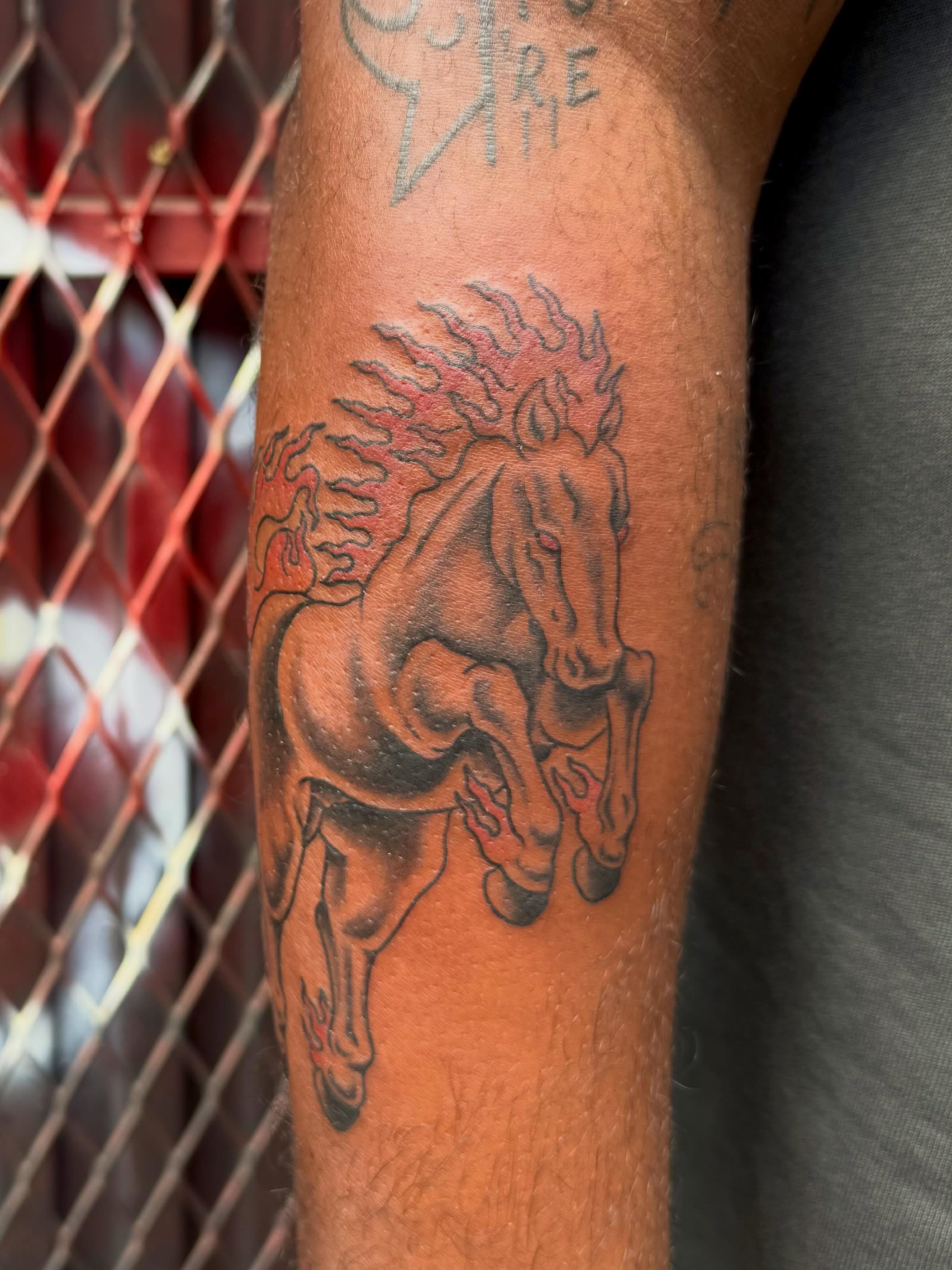 Galloping horse black and grey tattoo on the forearm by 𝕯𝖗𝖆𝕶𝖊㋛