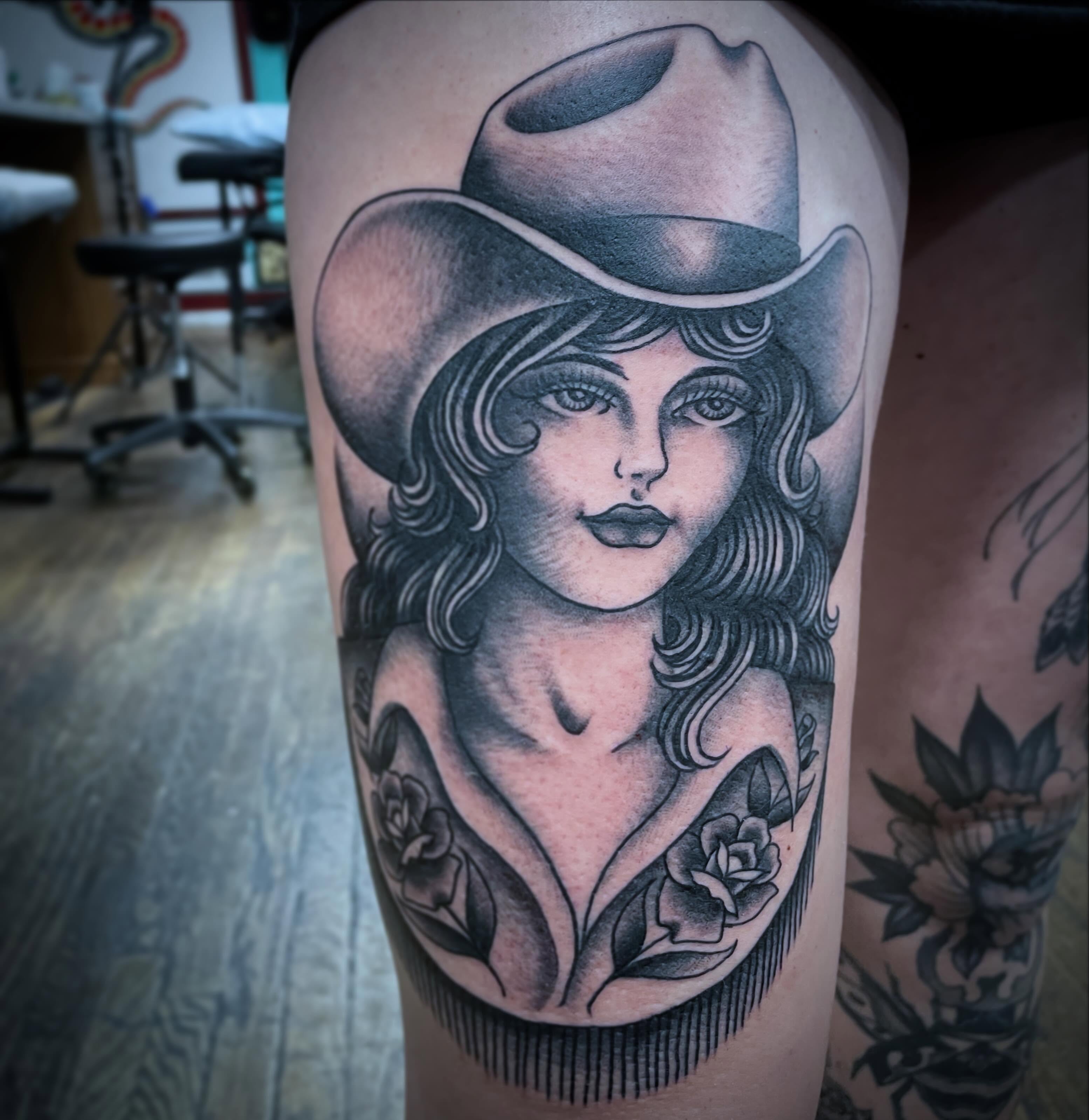 Cowgirl portrait American traditional tattoo on the thigh by Haley McMahon