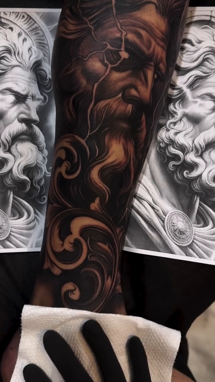 Greek god portrait with ornate swirls realism tattoo by Tattoo