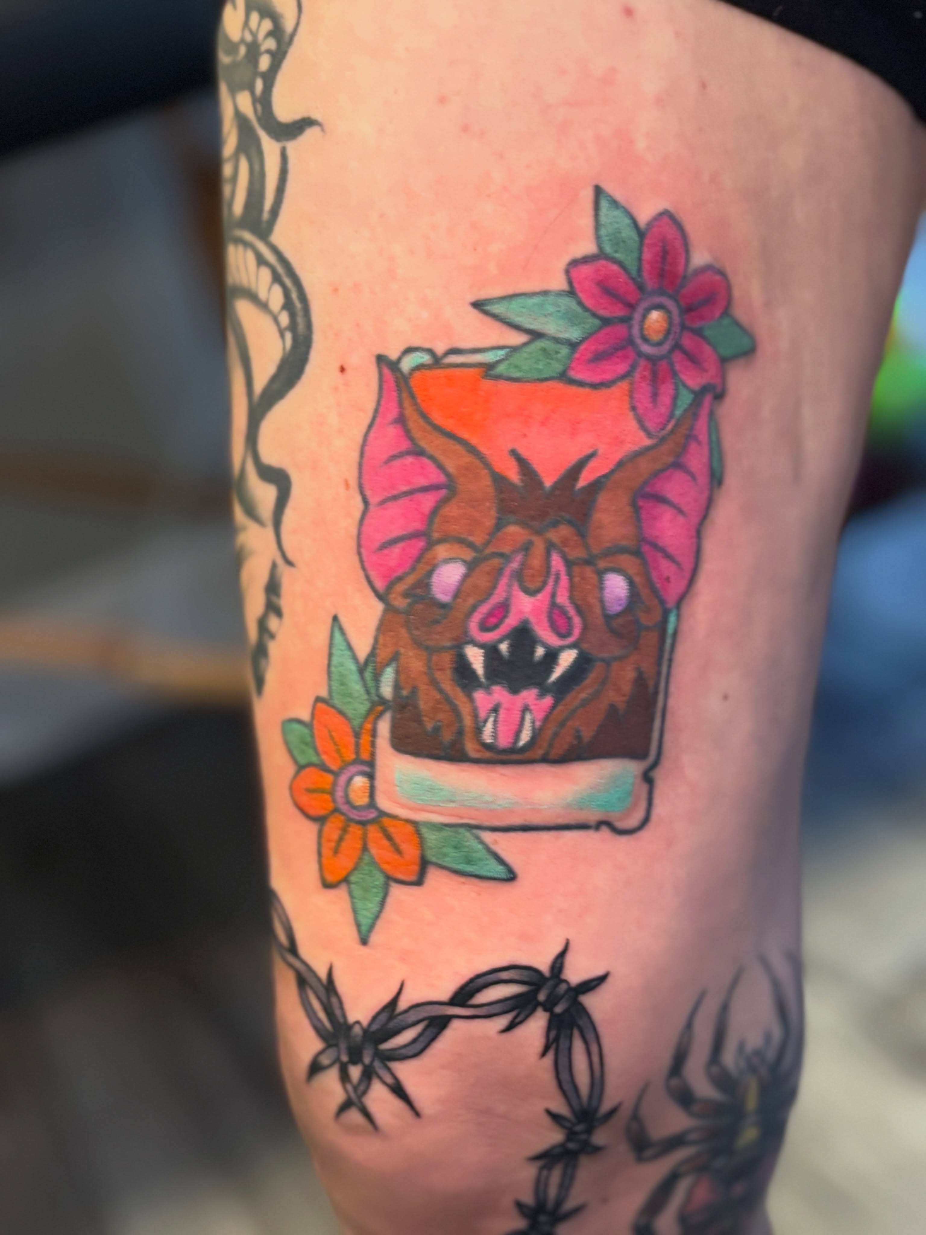 Bull head with flowers American traditional tattoo on the forearm by Bekah Smith