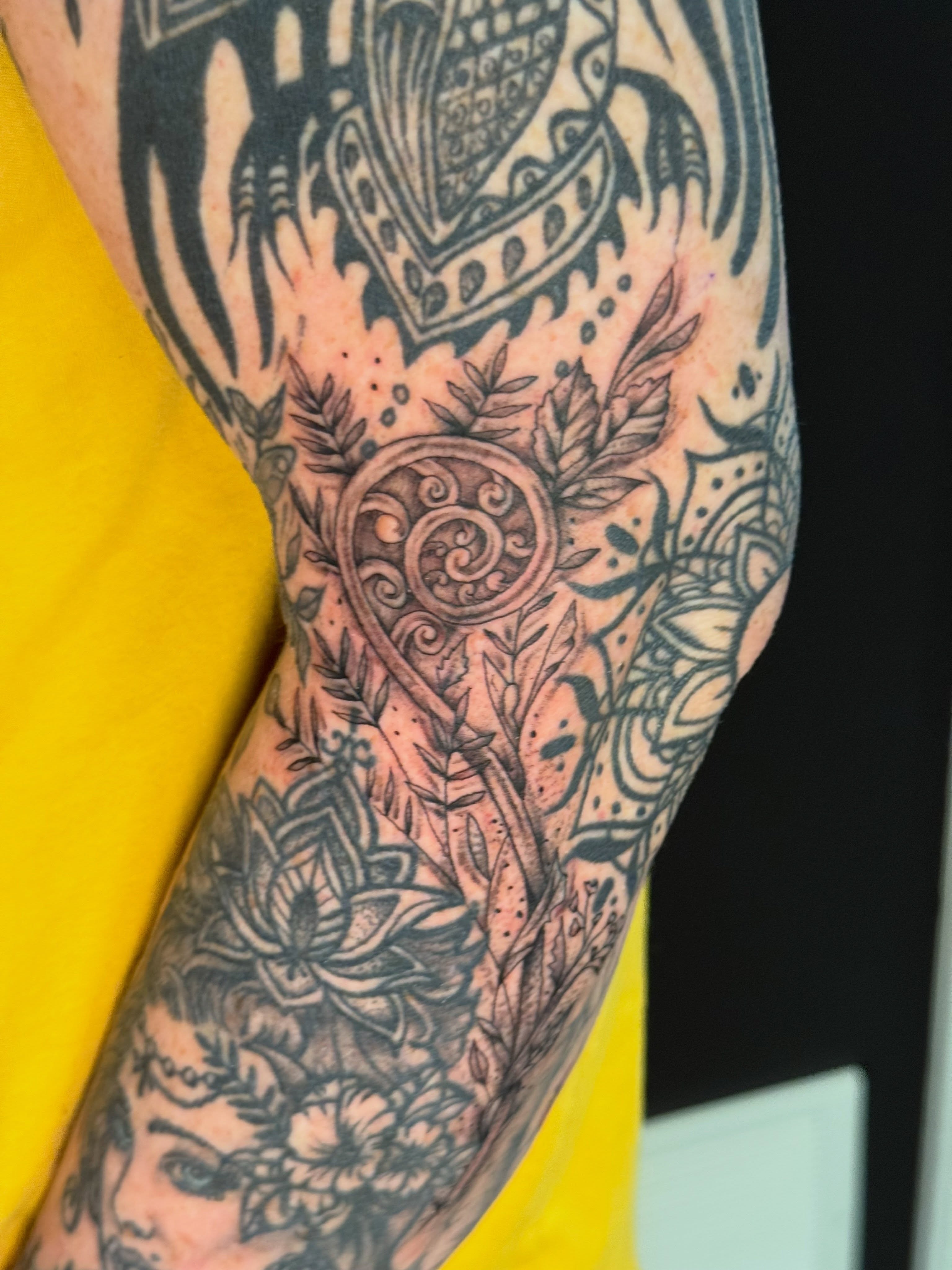 Floral and geometric patterns ornamental tattoo on the forearm by Michelle Balhan