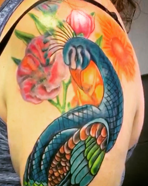 Peacock and flowers American traditional tattoo on the shoulder by Tattoos by Dan Hatcher Carr, Parma, Ohio