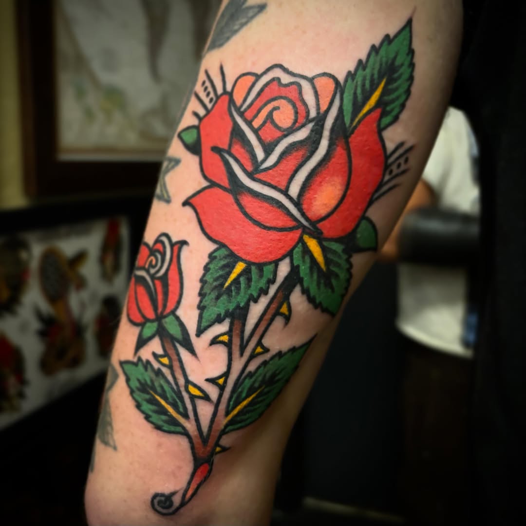 Red rose American traditional tattoo on the forearm by Danny DiBlasi, San Francisco, California