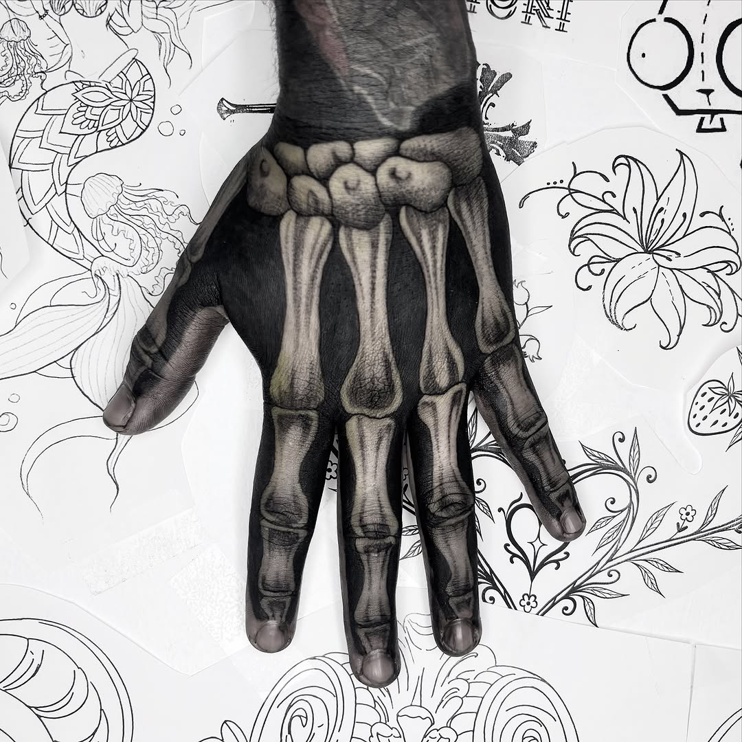 Skeleton hand realism tattoo on the hand by Weho Tattoo Artist Lupe
