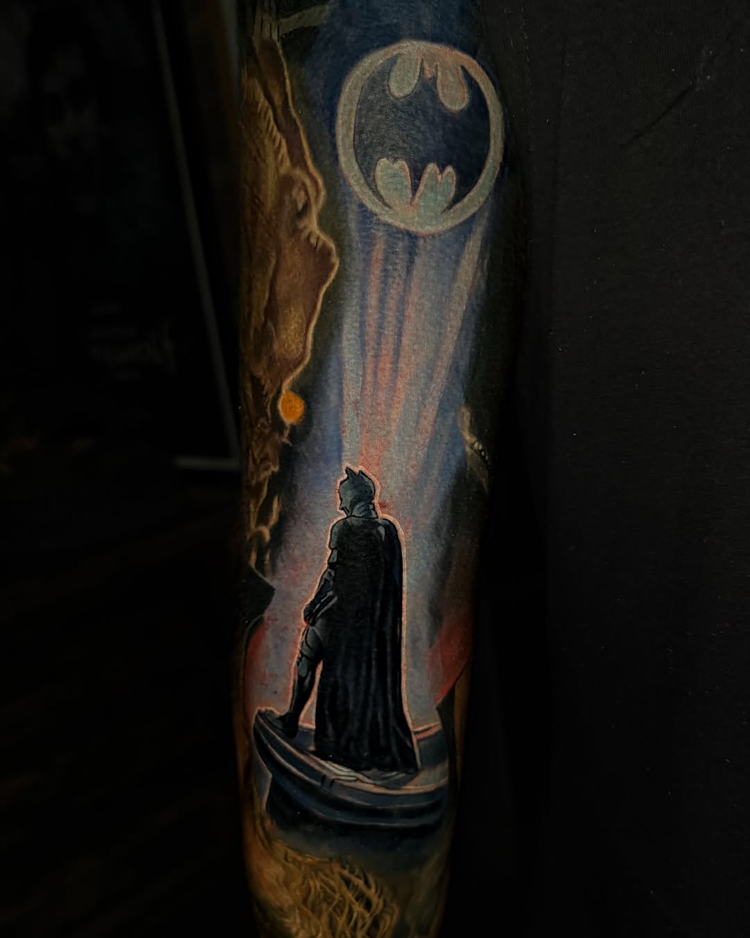 Batman dark realism tattoo on the forearm by Dave James
