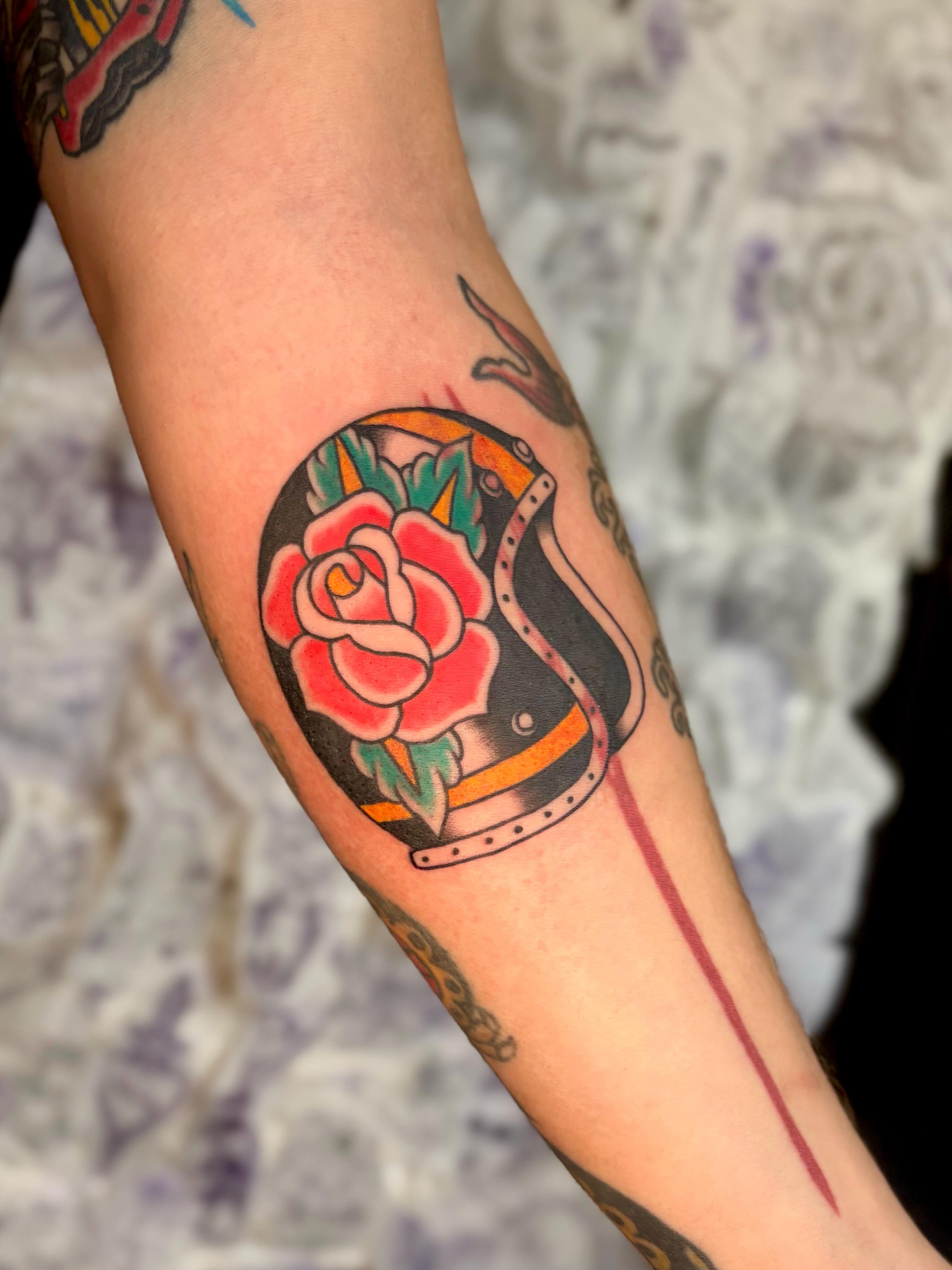 Rose and helmet American traditional tattoo on the forearm by Danelle ✶ Nashville Tattooer