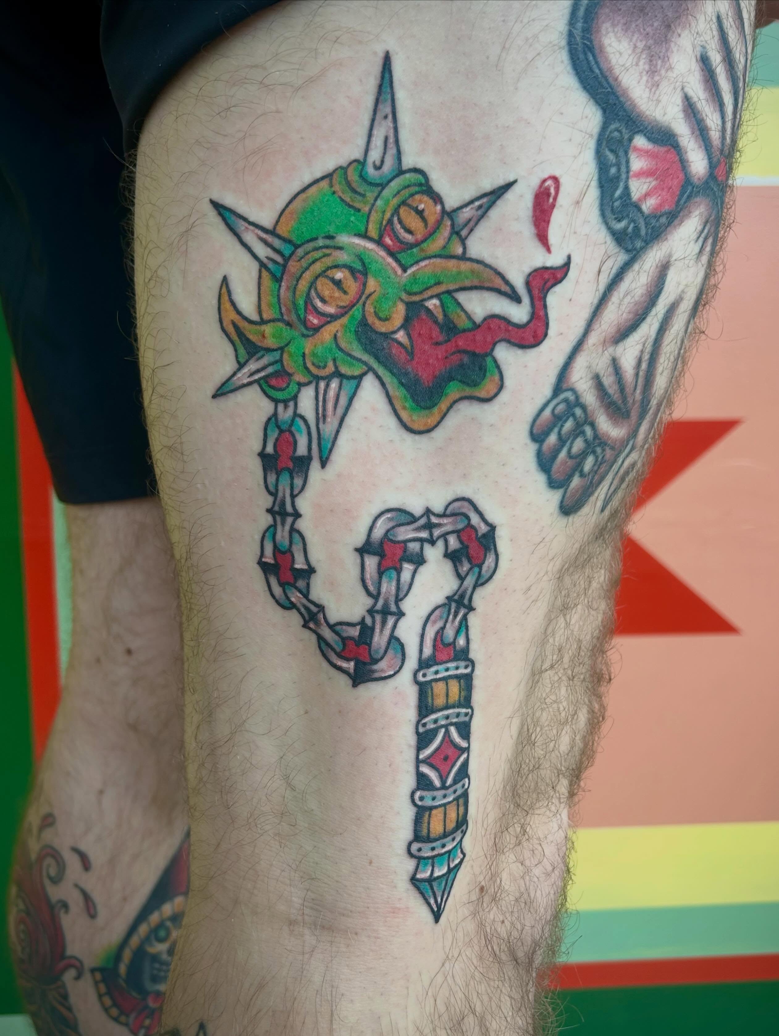Demon mask and sword neo-traditional tattoo on the thigh by Bria🩸