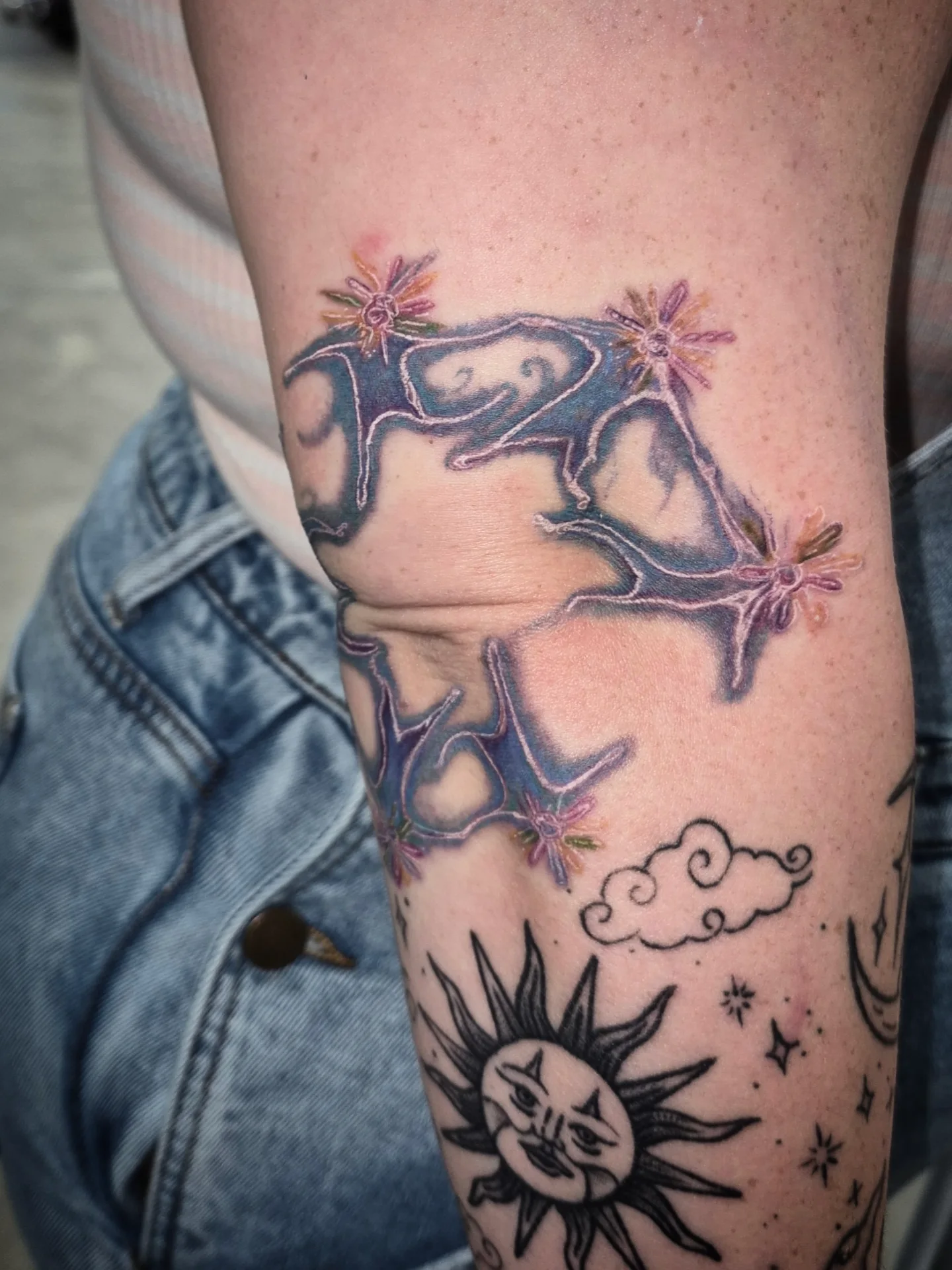 Skydiving neo-traditional tattoo on the forearm by Lydia Kiley
