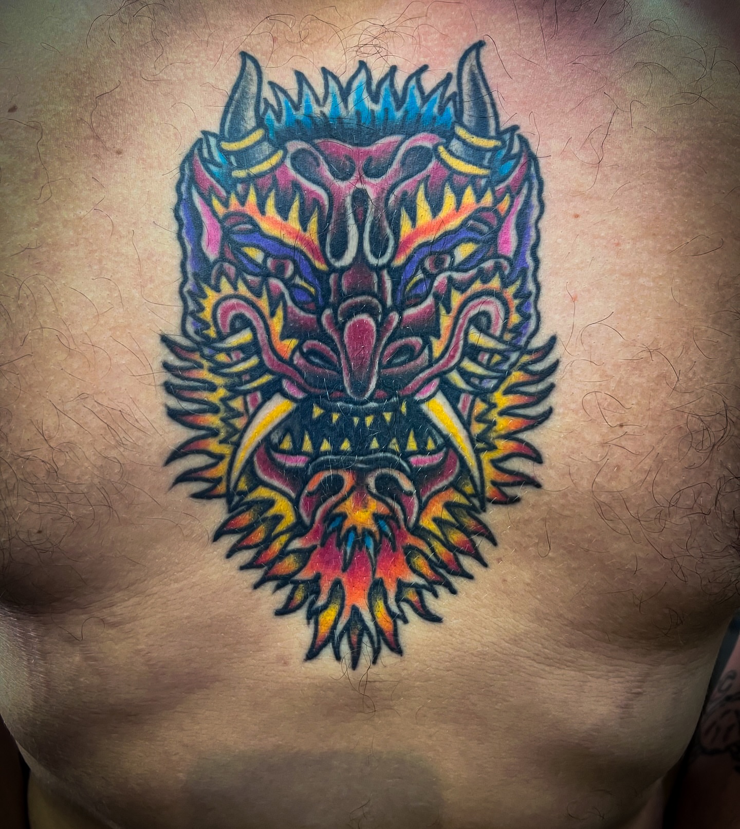 Demon mask japanese irezumi tattoo on the chest by Scott Allen