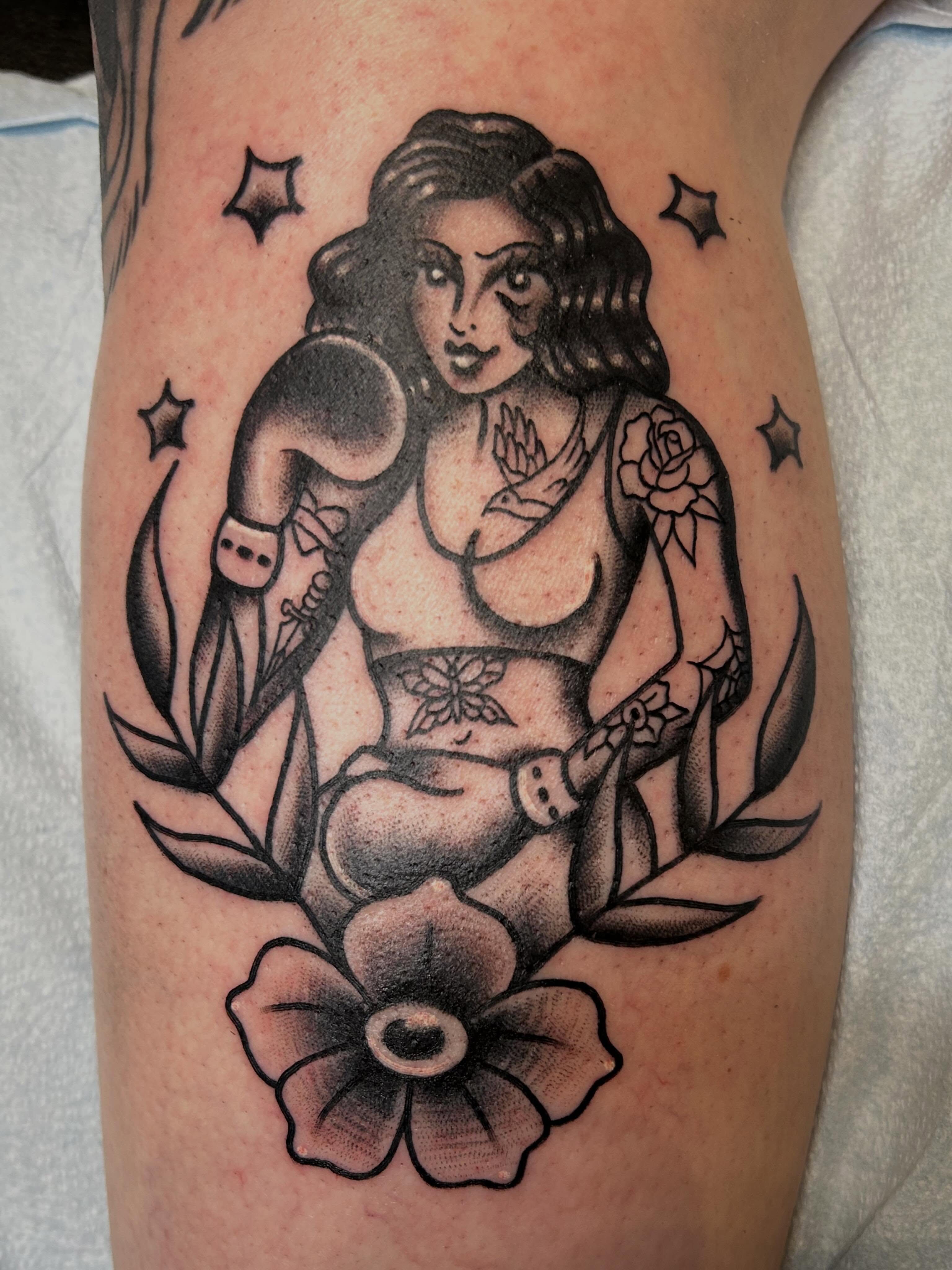 Woman with baby American traditional tattoo on the forearm by Morgan Hazer Tattoos, Cedar Rapids, Iowa