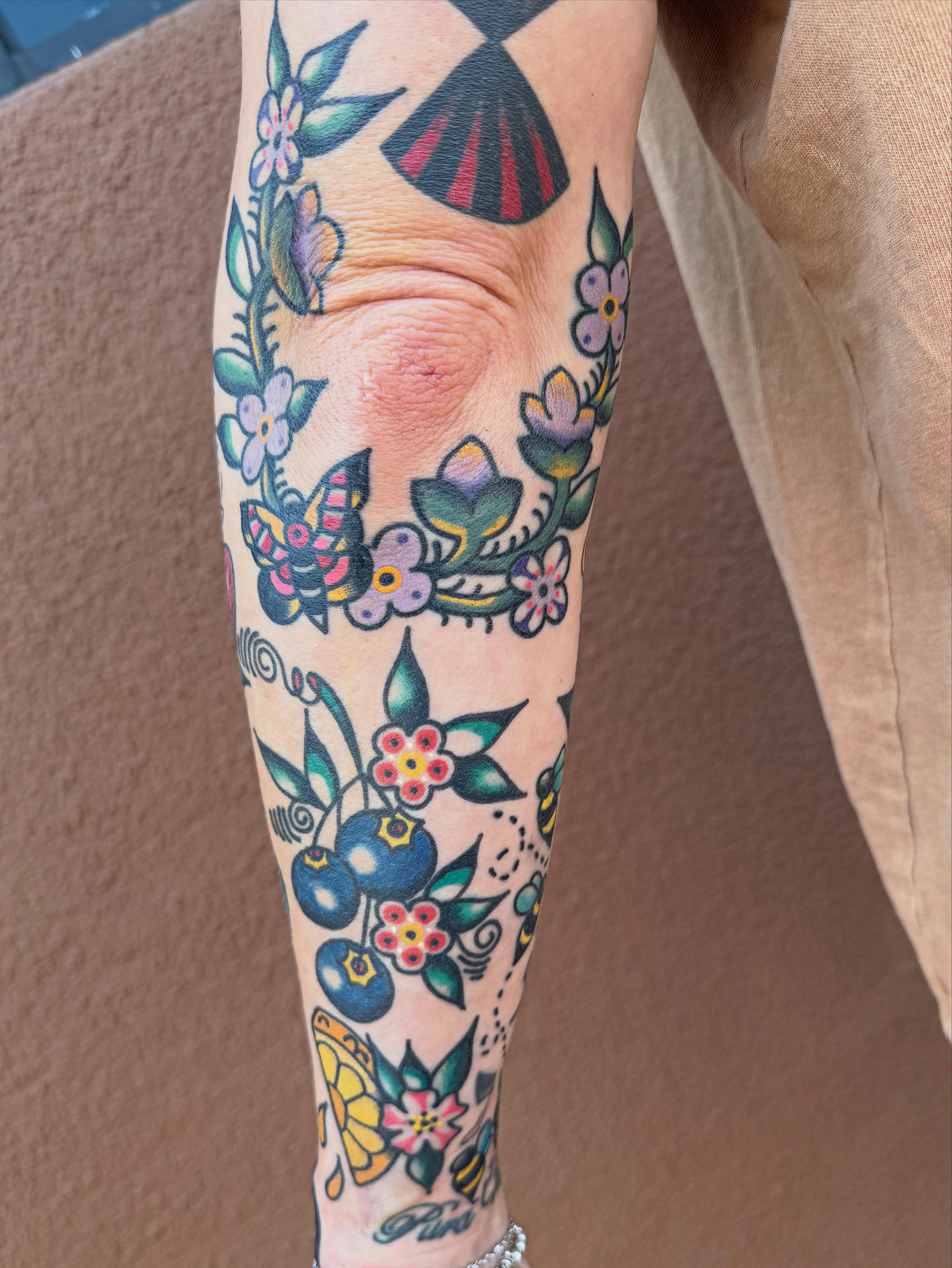 Floral arrangement American traditional tattoo on the forearm by Tanya Gomez