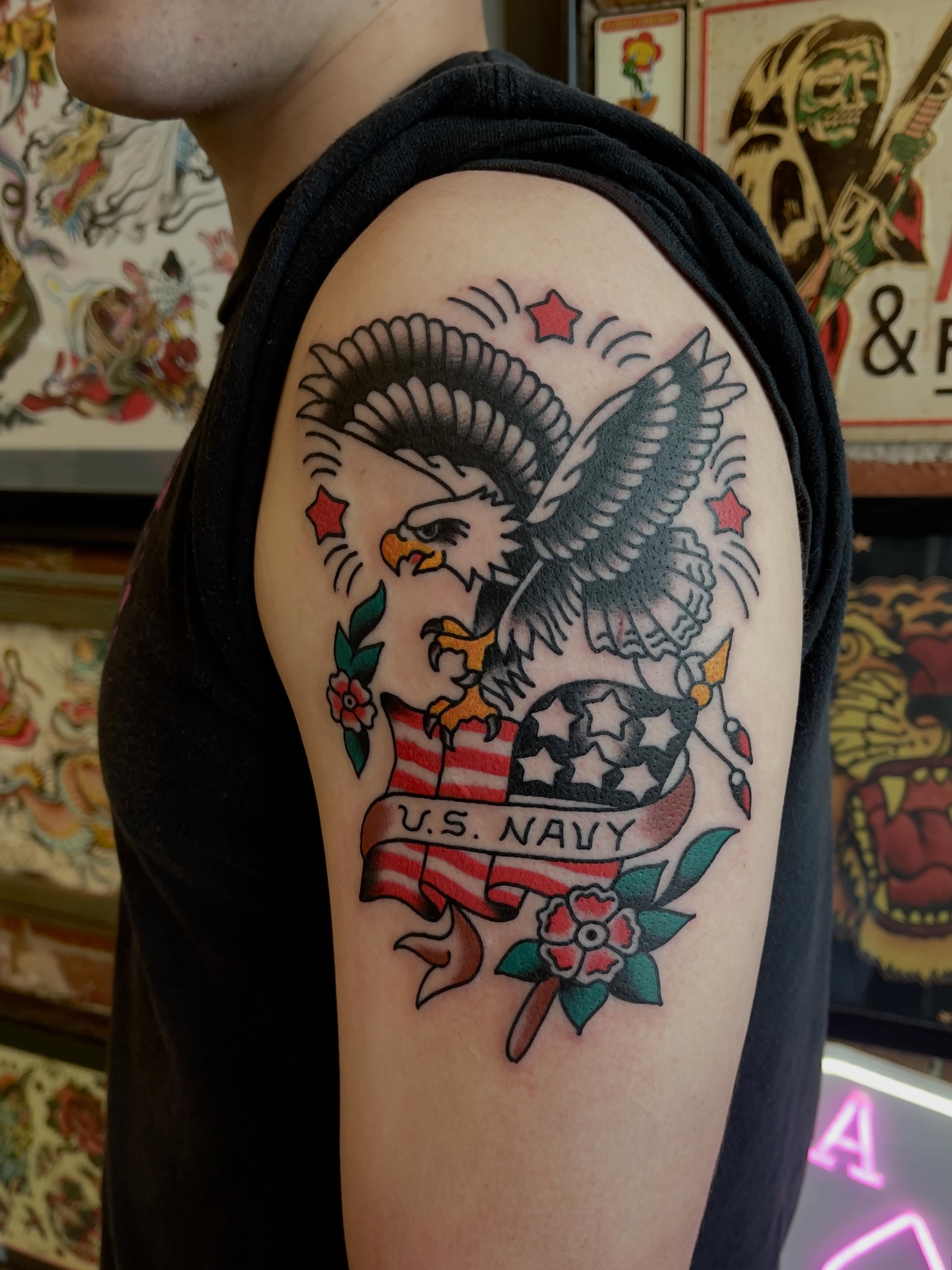 Eagle and U.S. Navy banner American traditional tattoo on the shoulder by Spencer Reisbeck