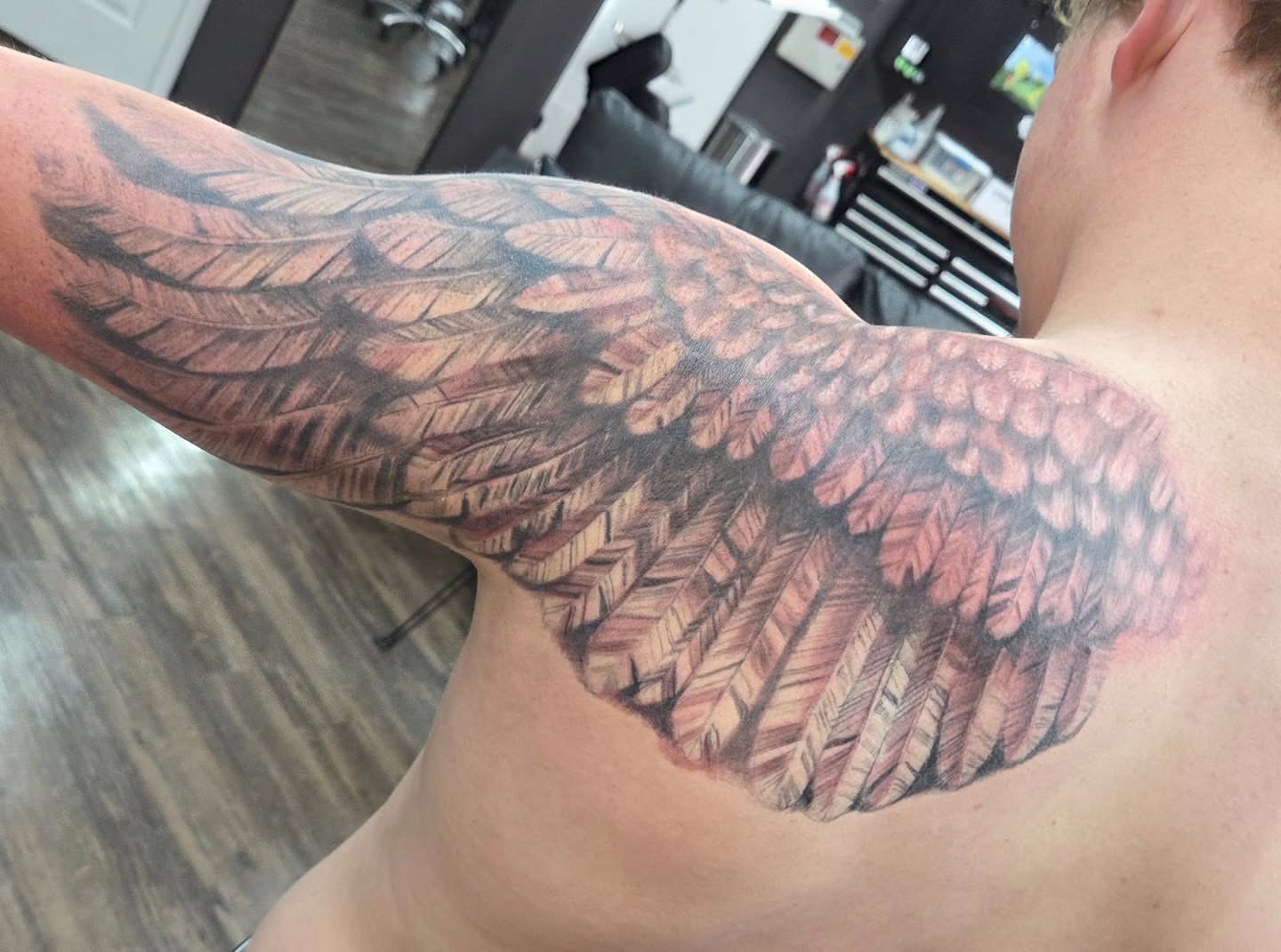 Wing realism tattoo on the shoulder by Matthew Todd Kremer