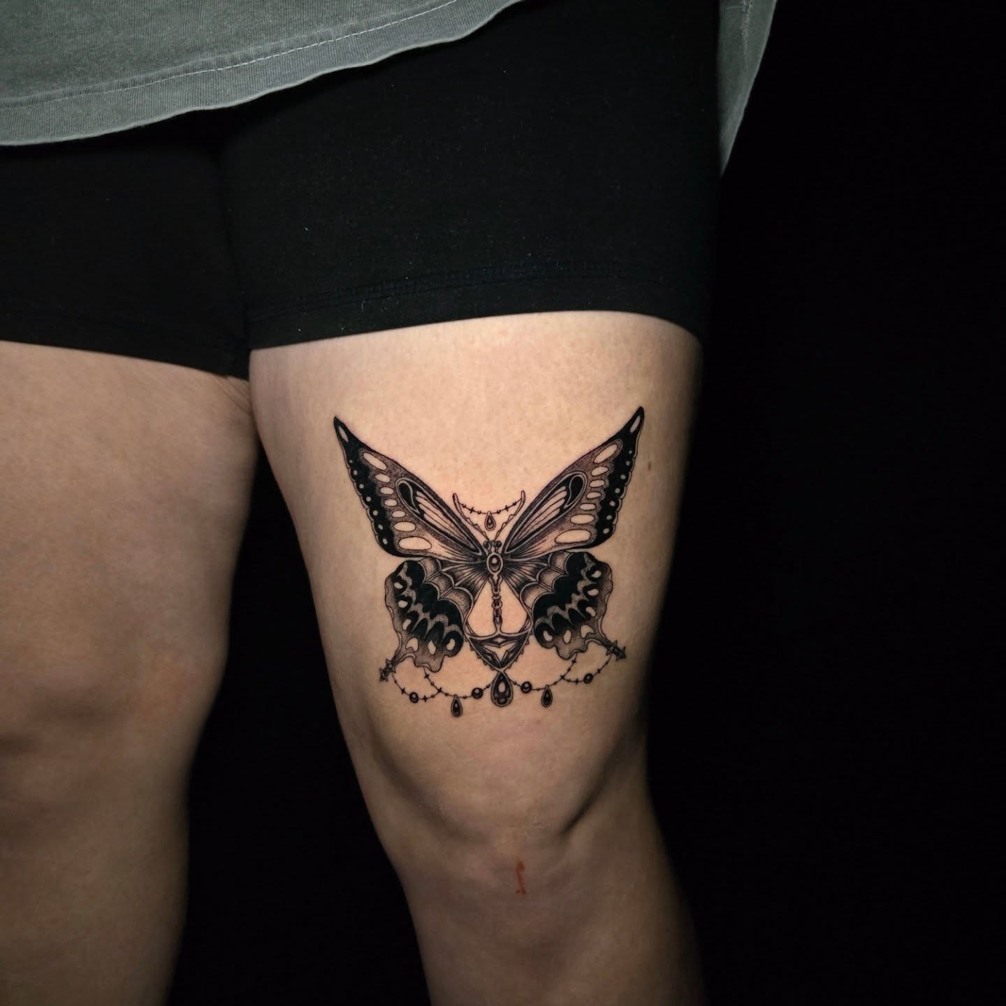Butterfly geometric tattoo on the thigh by Perry