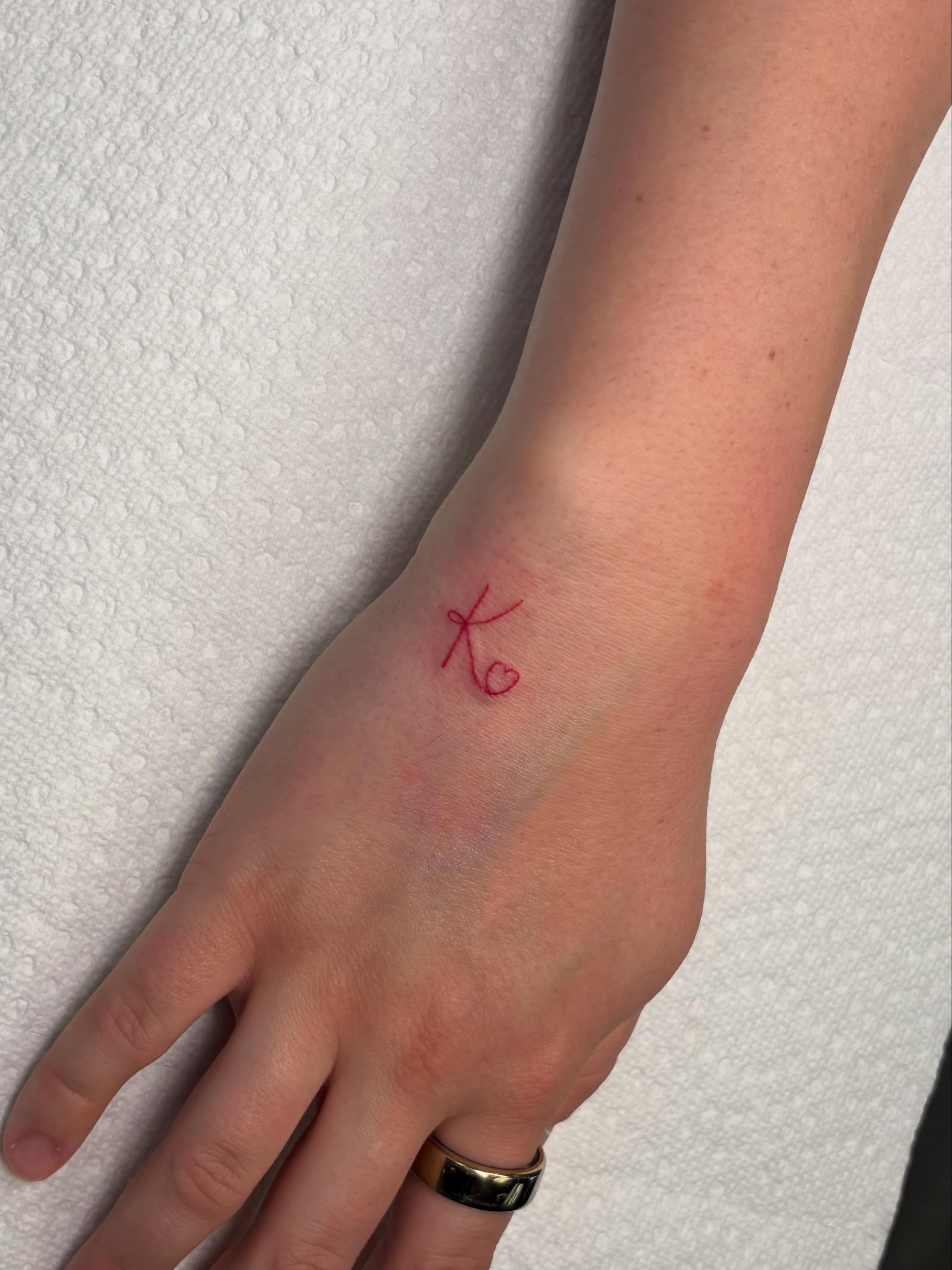 Initial with heart lettering script tattoo on the hand by ππ‘ππ―π² πππ₯π₯ππ²