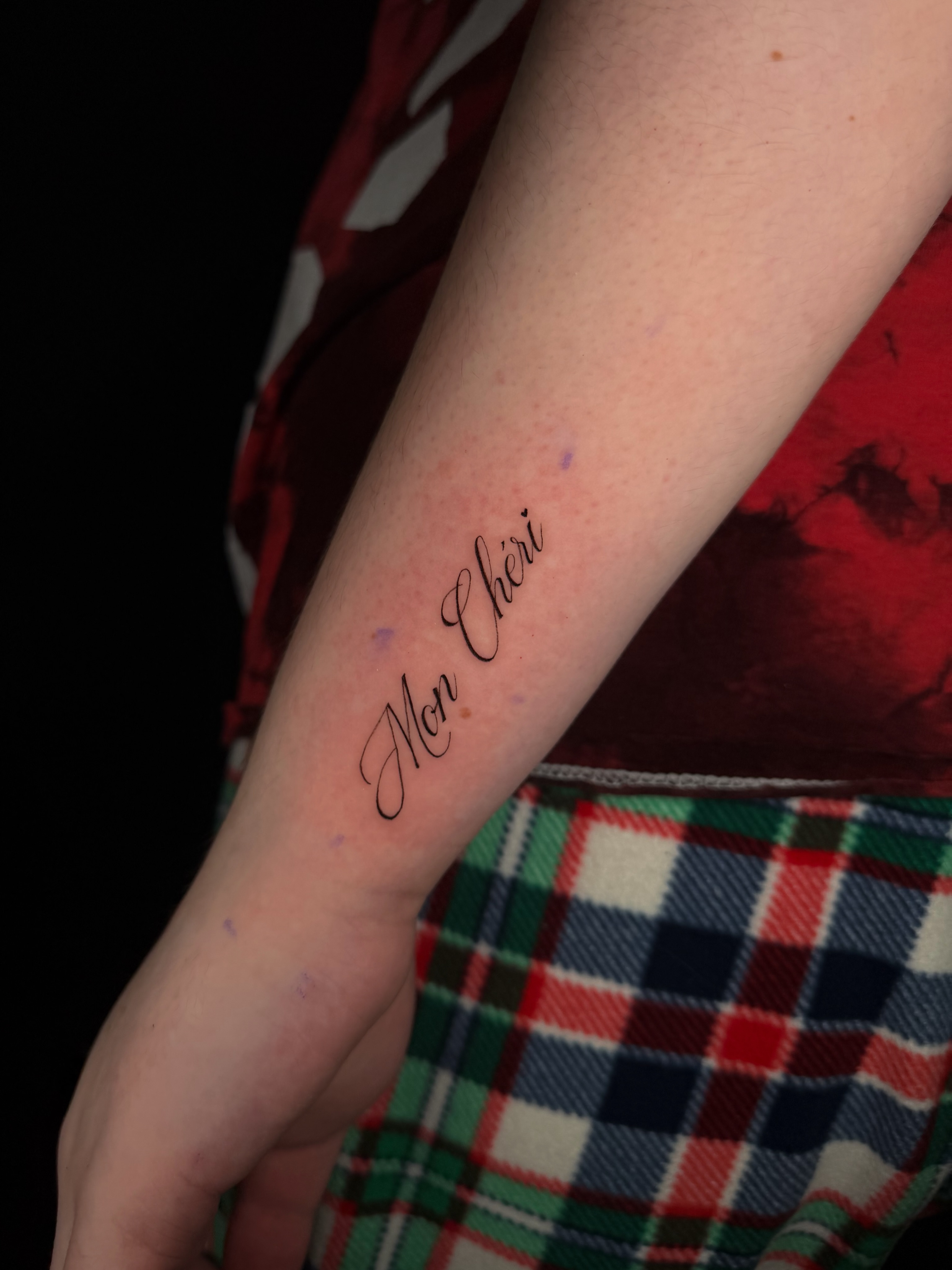 Mon Chéri lettering script tattoo on the forearm by Marianne