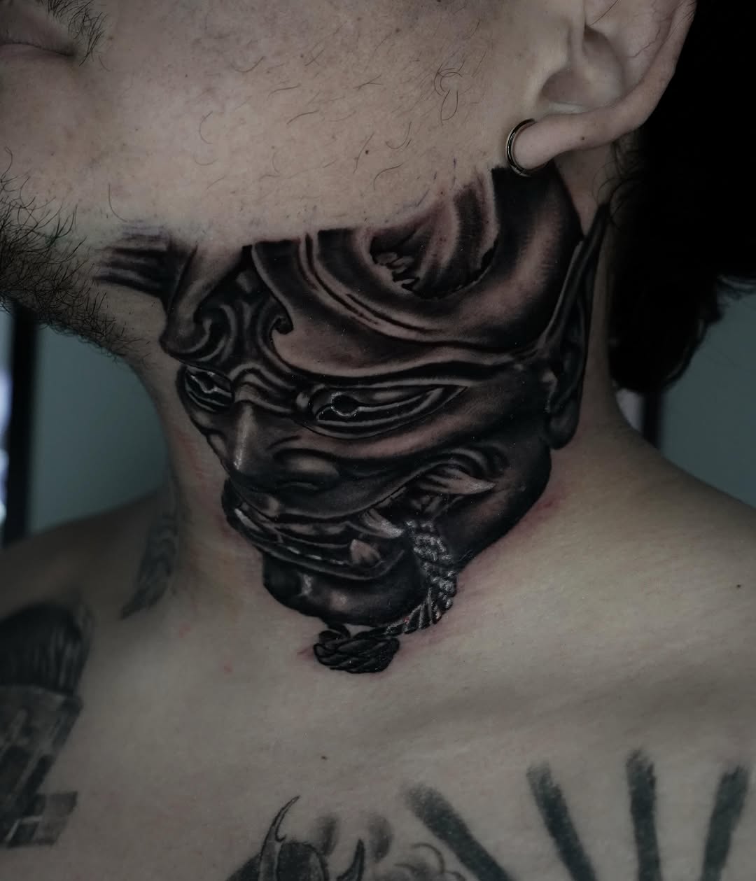 Oni mask Japanese tattoo on the neck by Carlos Trujillo