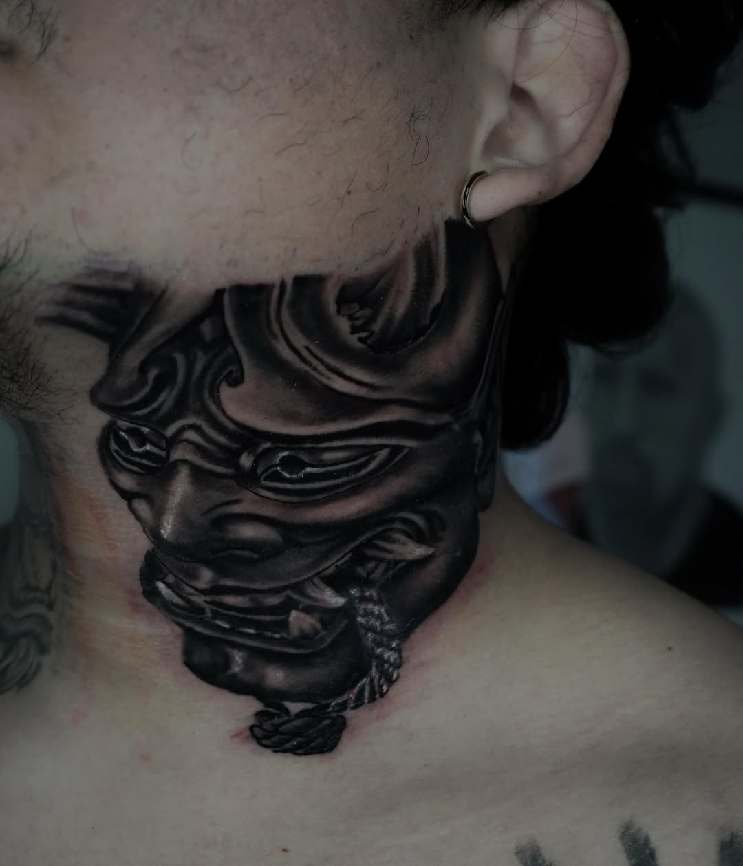 Oni mask Japanese tattoo on the neck by Carlos Trujillo