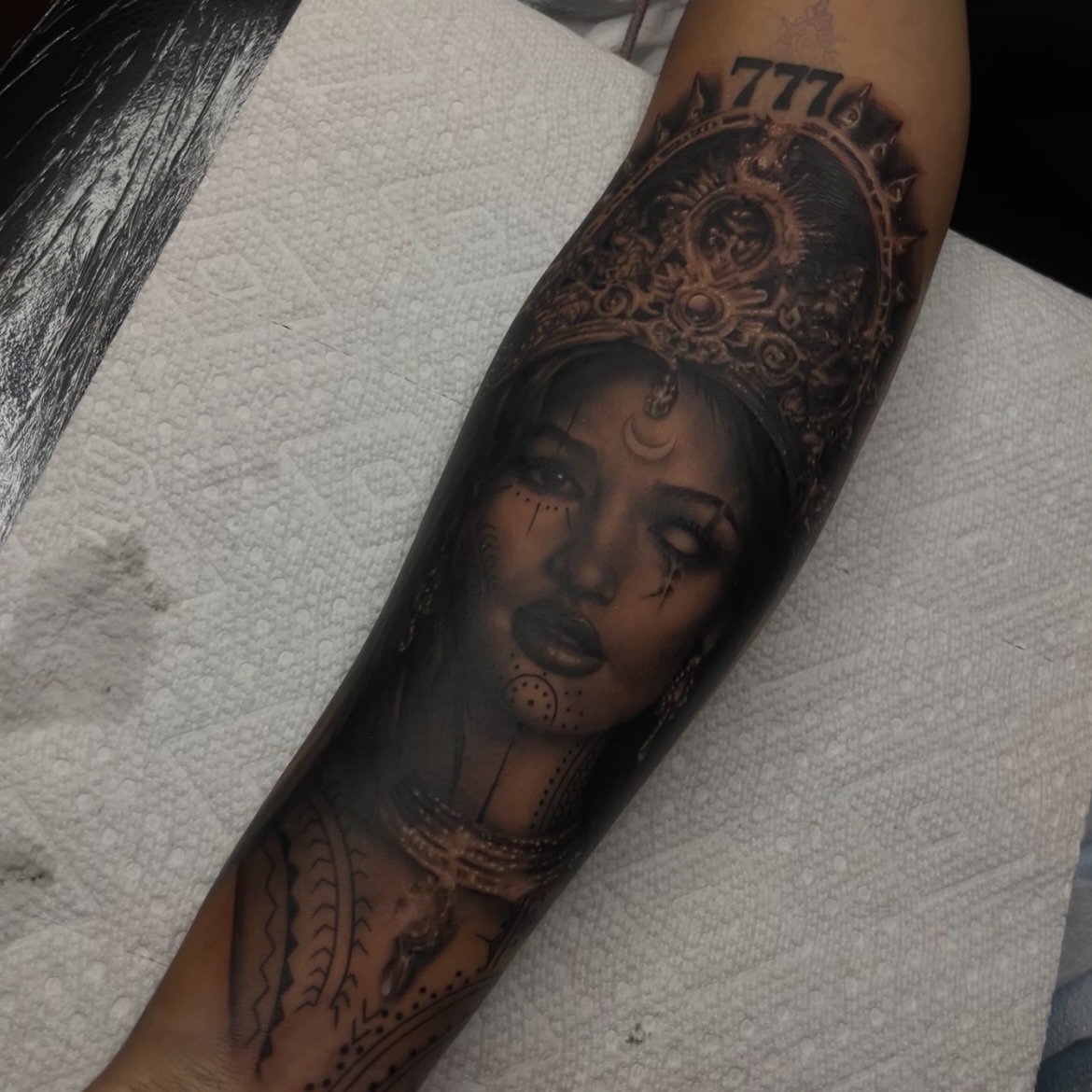 Woman with crown realism tattoo on the forearm by ✨tiffy ✨