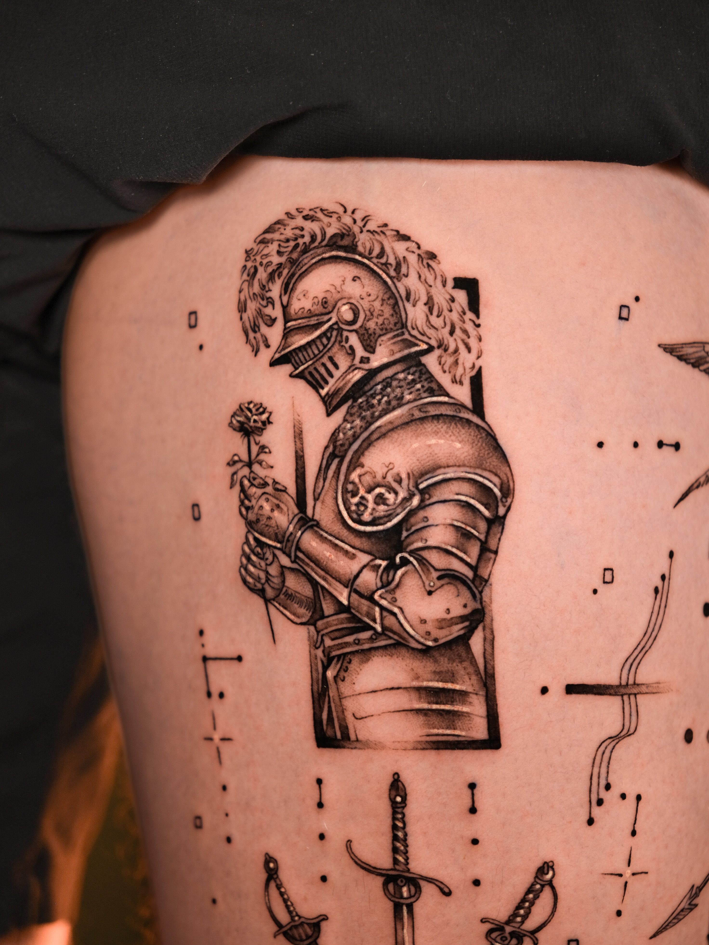 Knight holding flower realism tattoo on the thigh by Tattoo Miami π