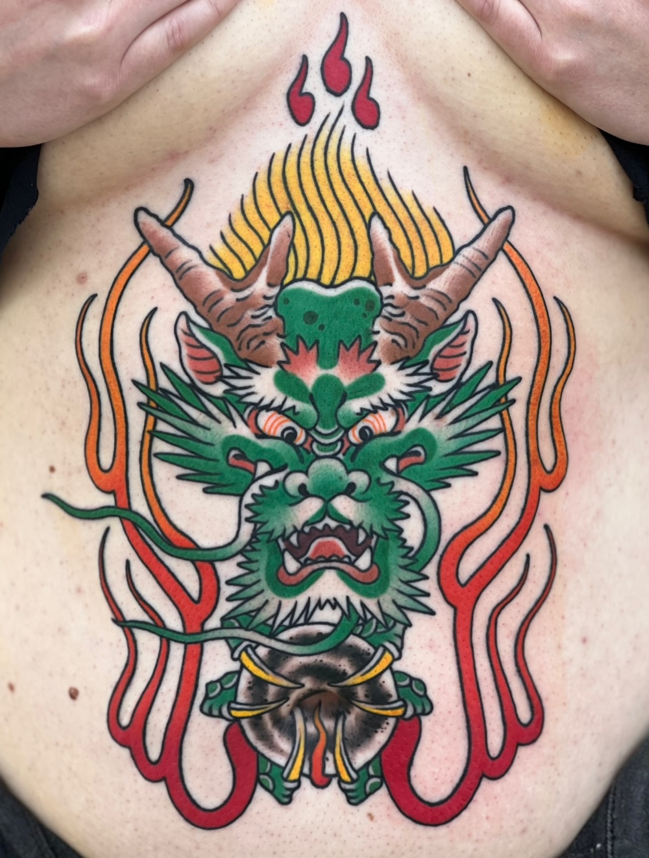 Dragon American traditional tattoo on the back by Tyler Wright