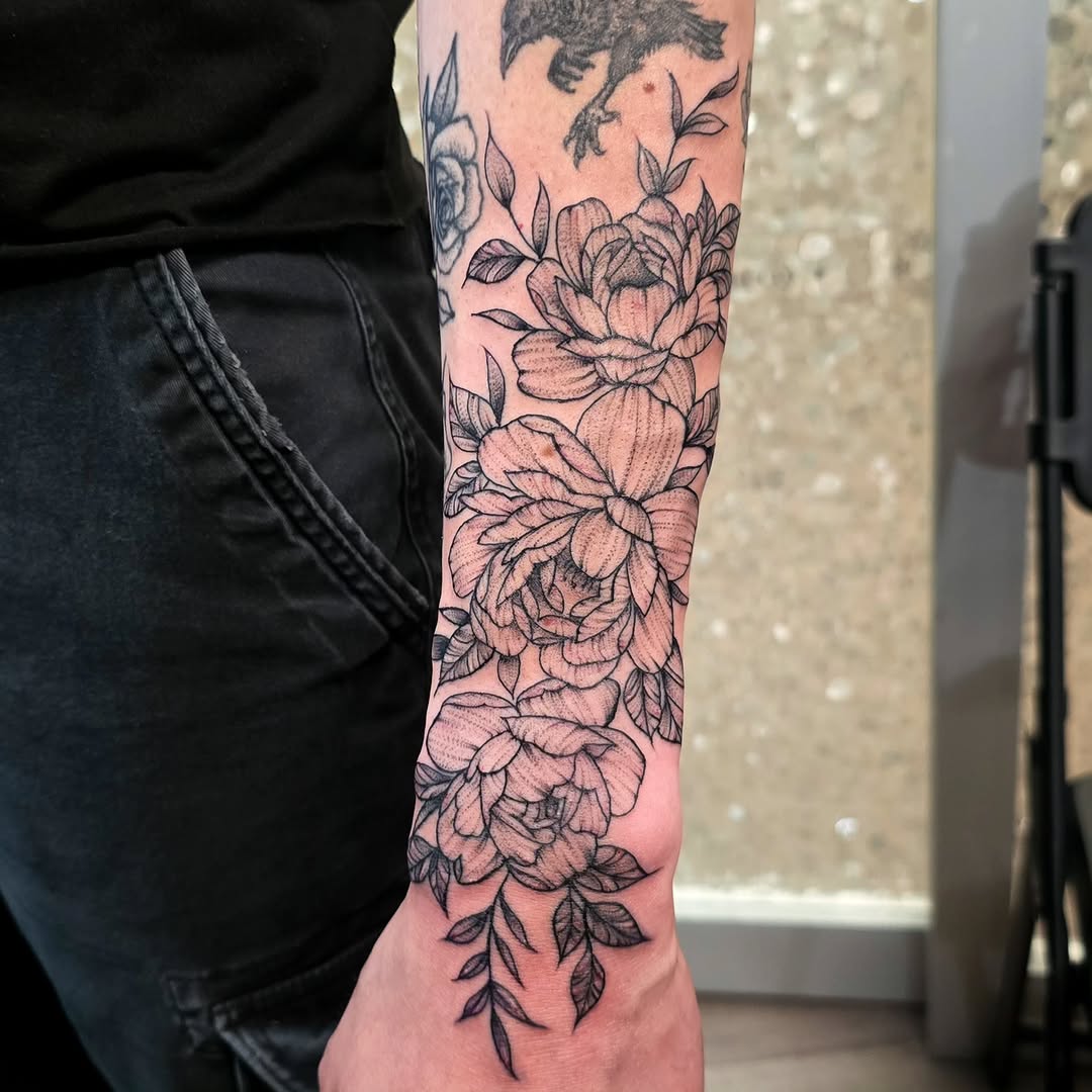 Floral bouquet black and grey tattoo on the forearm by Hope 🌙, Cincinnati