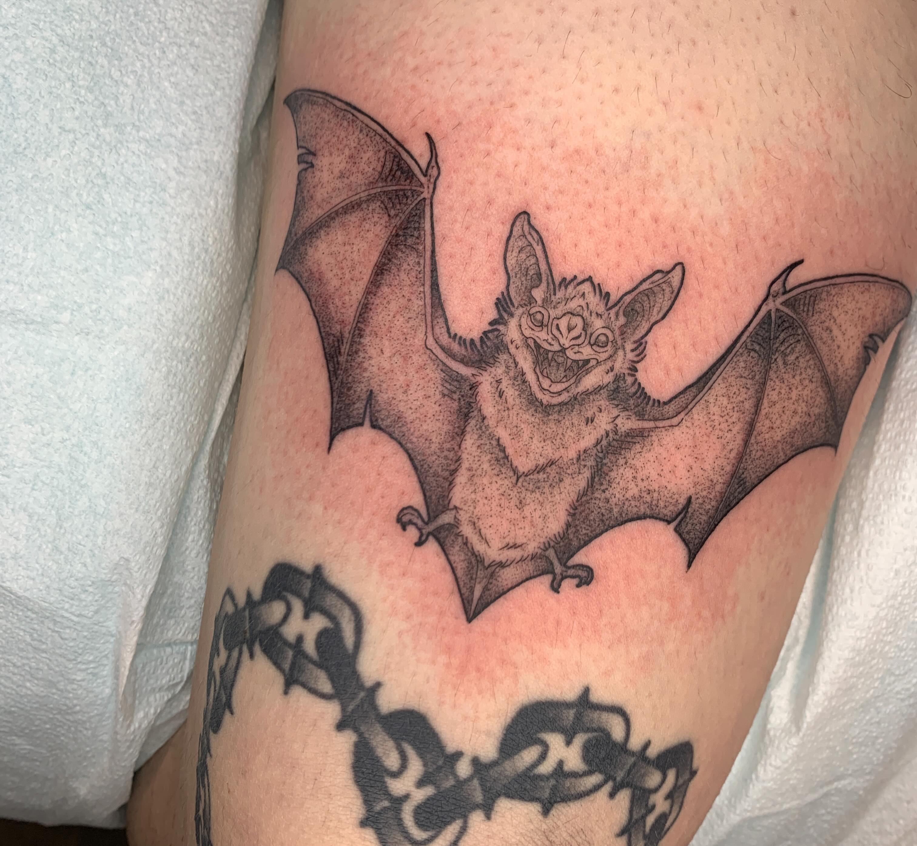 Bat dotwork tattoo on the thigh by Kitty Jones, Berkeley, California