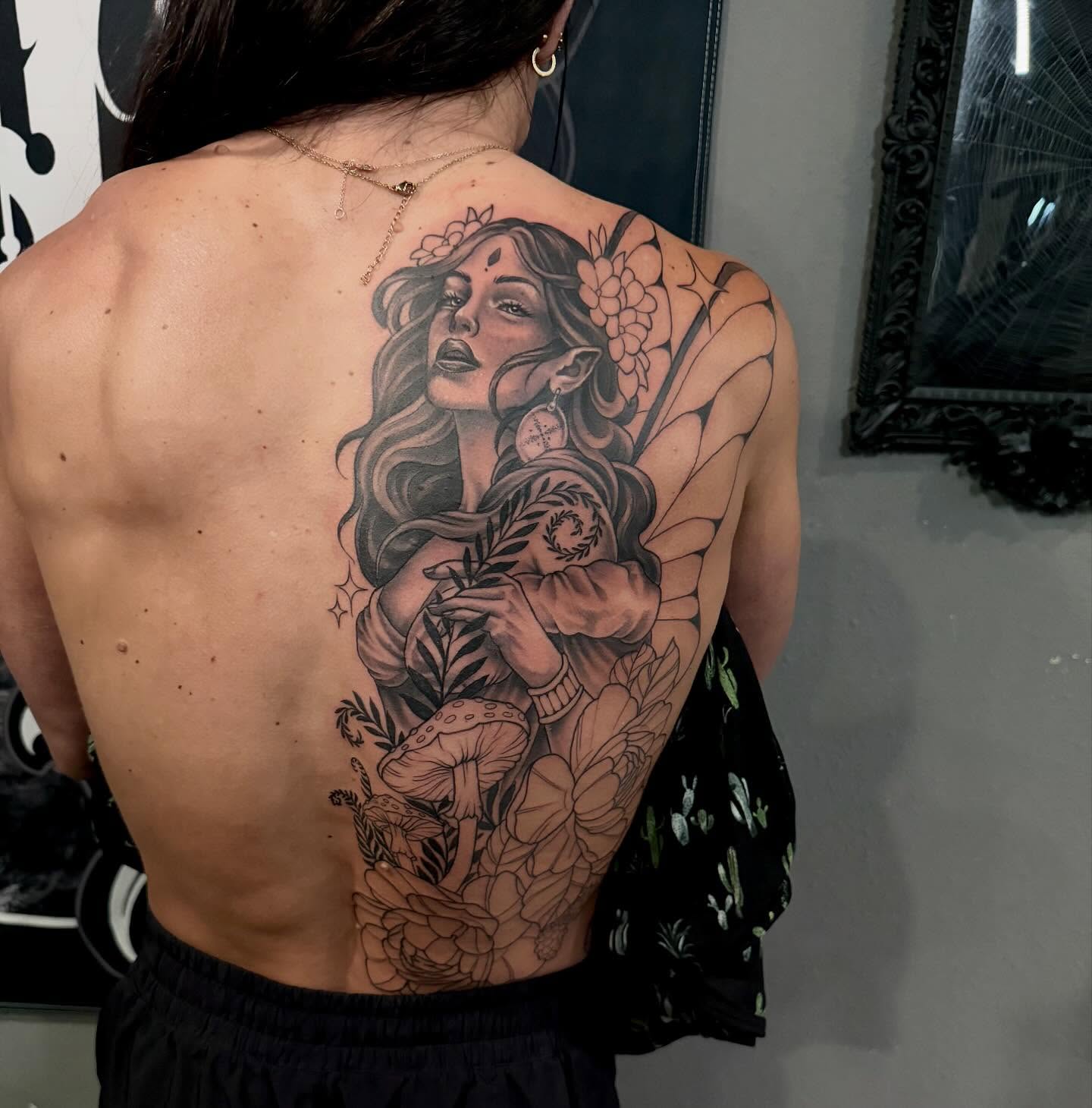 Elf-like woman neo-traditional tattoo on the back by Cody Pappas