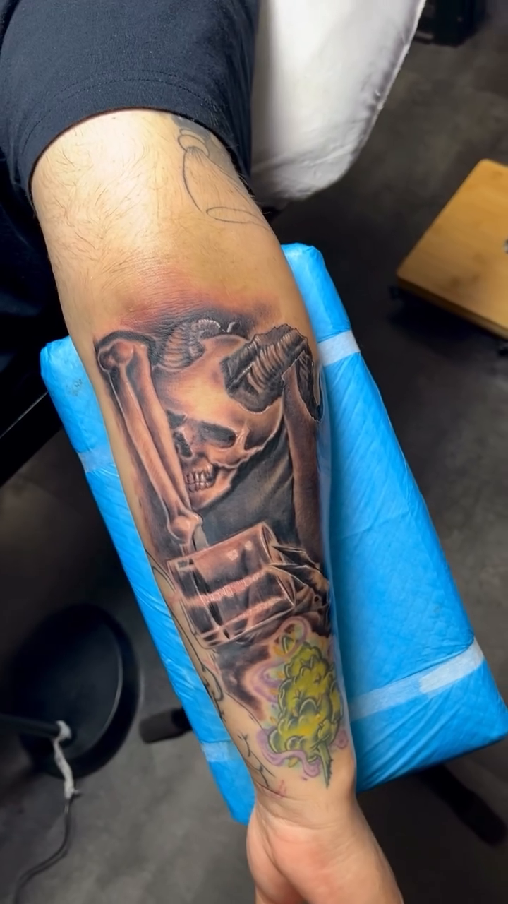 Skull with horns and architectural elements realism tattoo on the forearm by Yulia Chekir, Chicago, Illinois