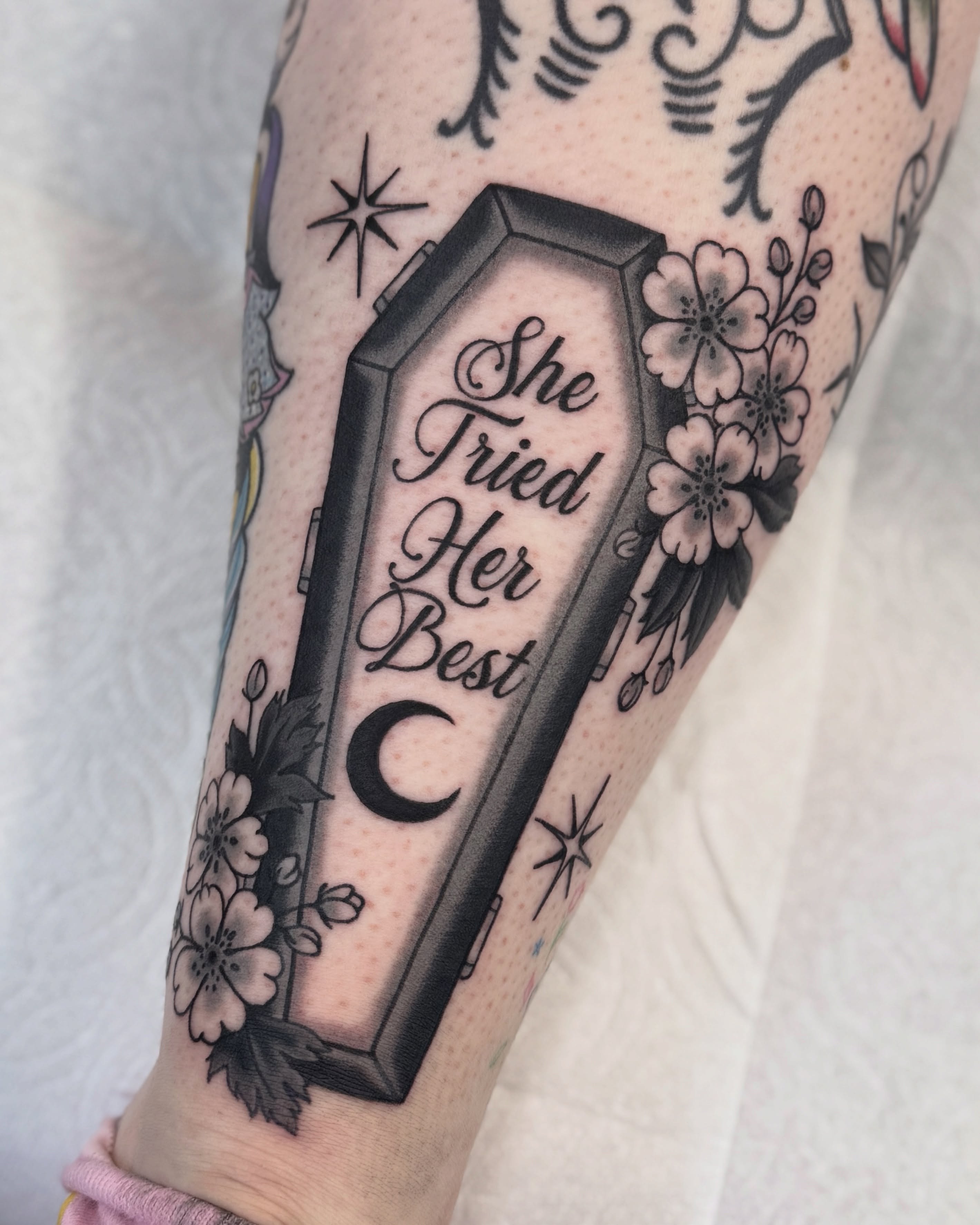 Coffin with text American traditional tattoo on the forearm by Nia (Knee-uhh) 🦷