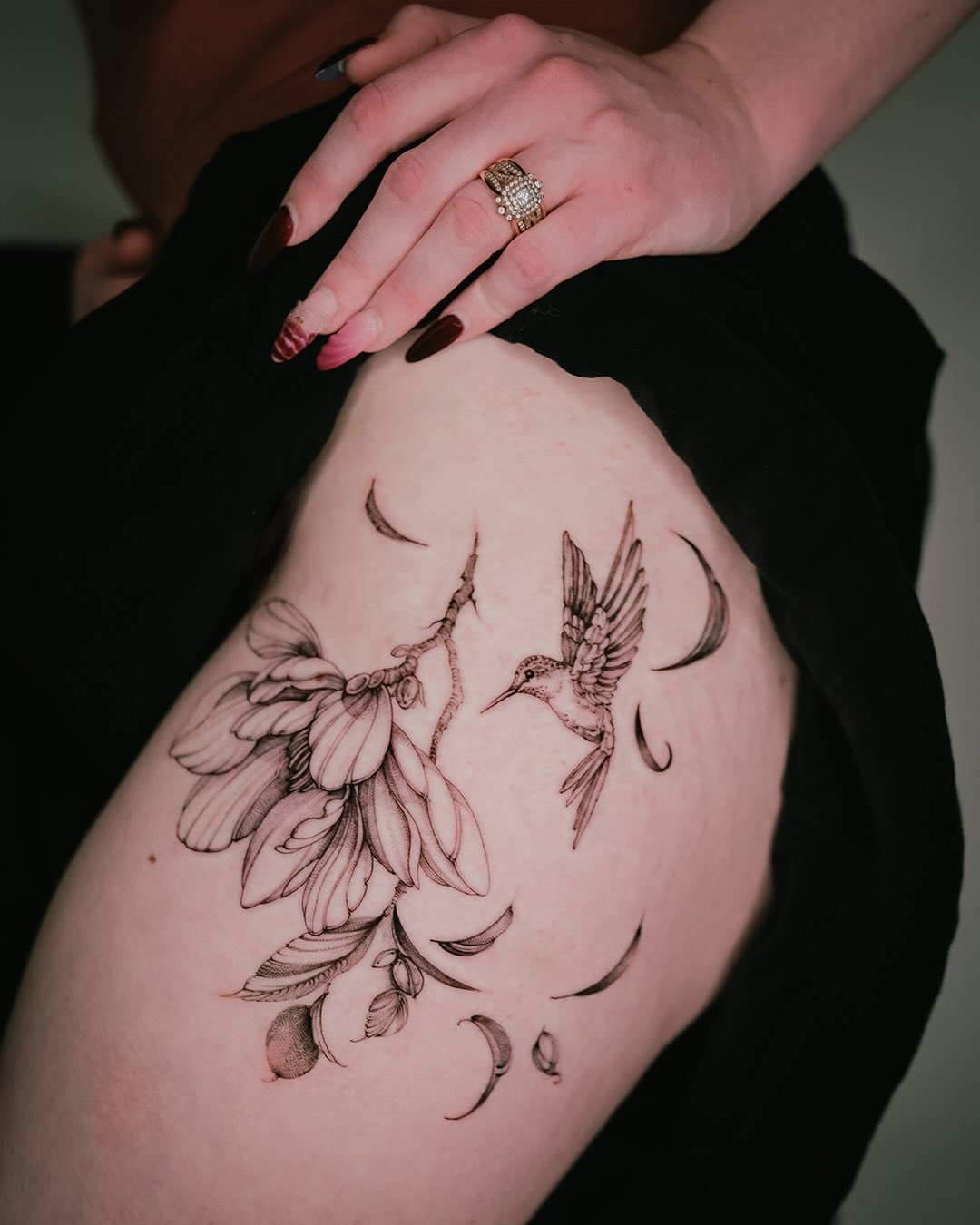 Bird and magnolia black and grey tattoo on the thigh by Esther ✣ Fine Line Floral Tattoo Artist LA, Los Angeles, California