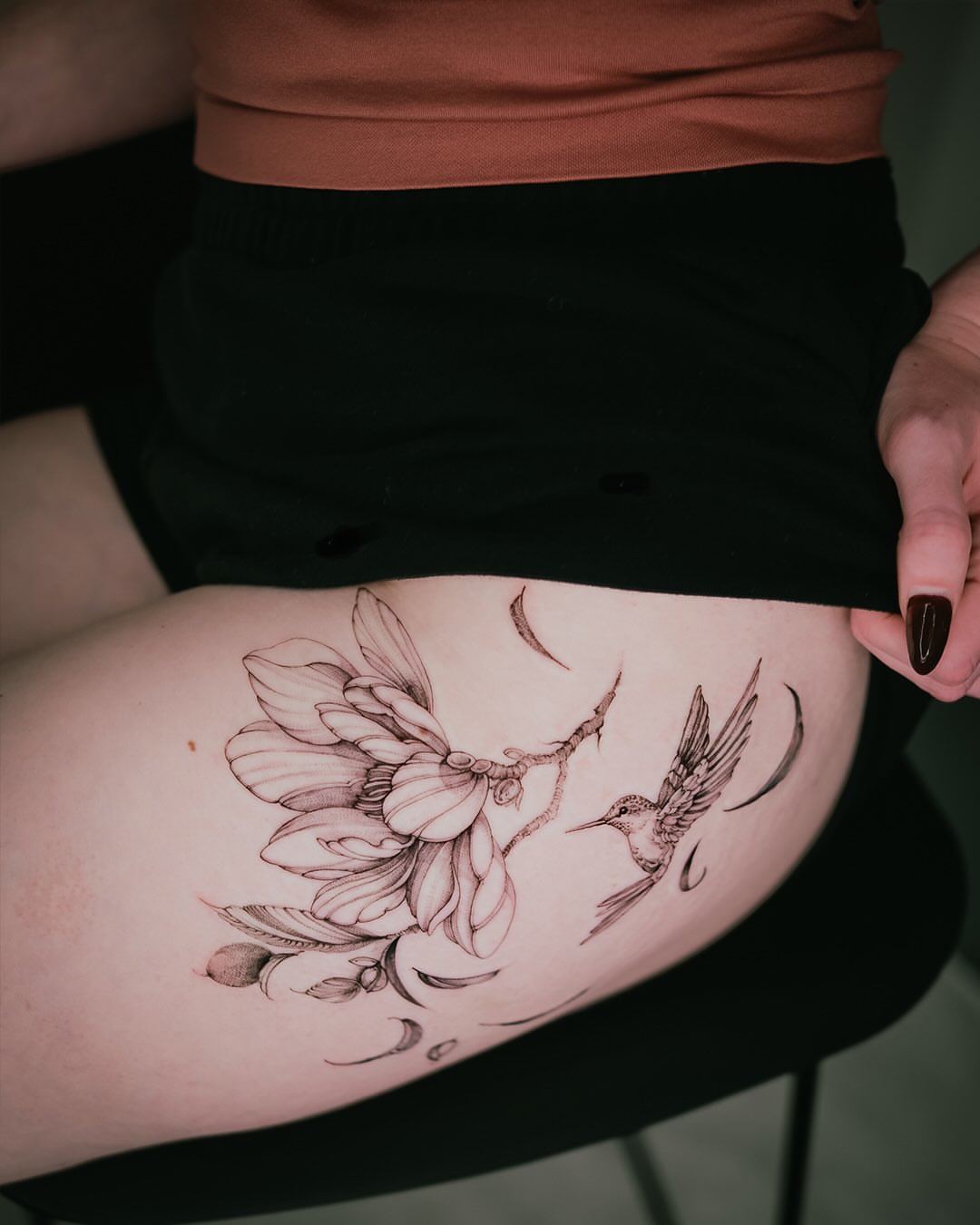 Hummingbird and magnolia realism tattoo on the thigh by Esther ✣ Fine Line Floral Tattoo Artist LA, Los Angeles, California