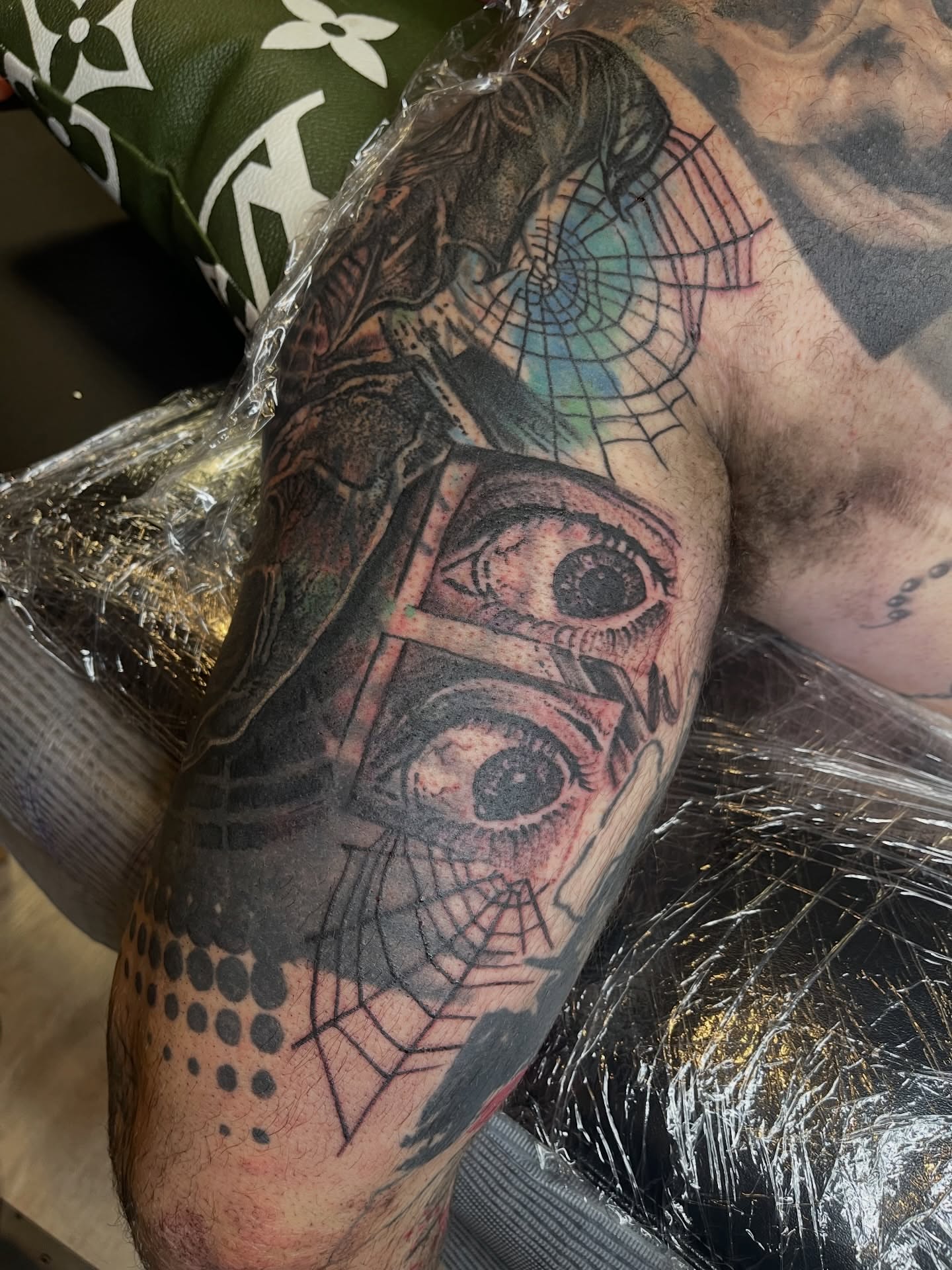 Eyes and spider web dotwork tattoo on the upper arm by carly g โ๏ธ ๐๐๐ค ๐ฝ๐๐๐ ๐๐ฆ
