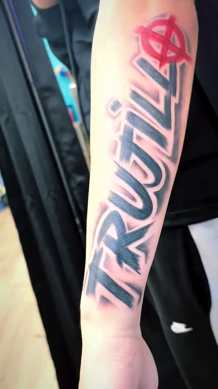 Tattoo by @tattedby_nat — lettering_script, blackwork