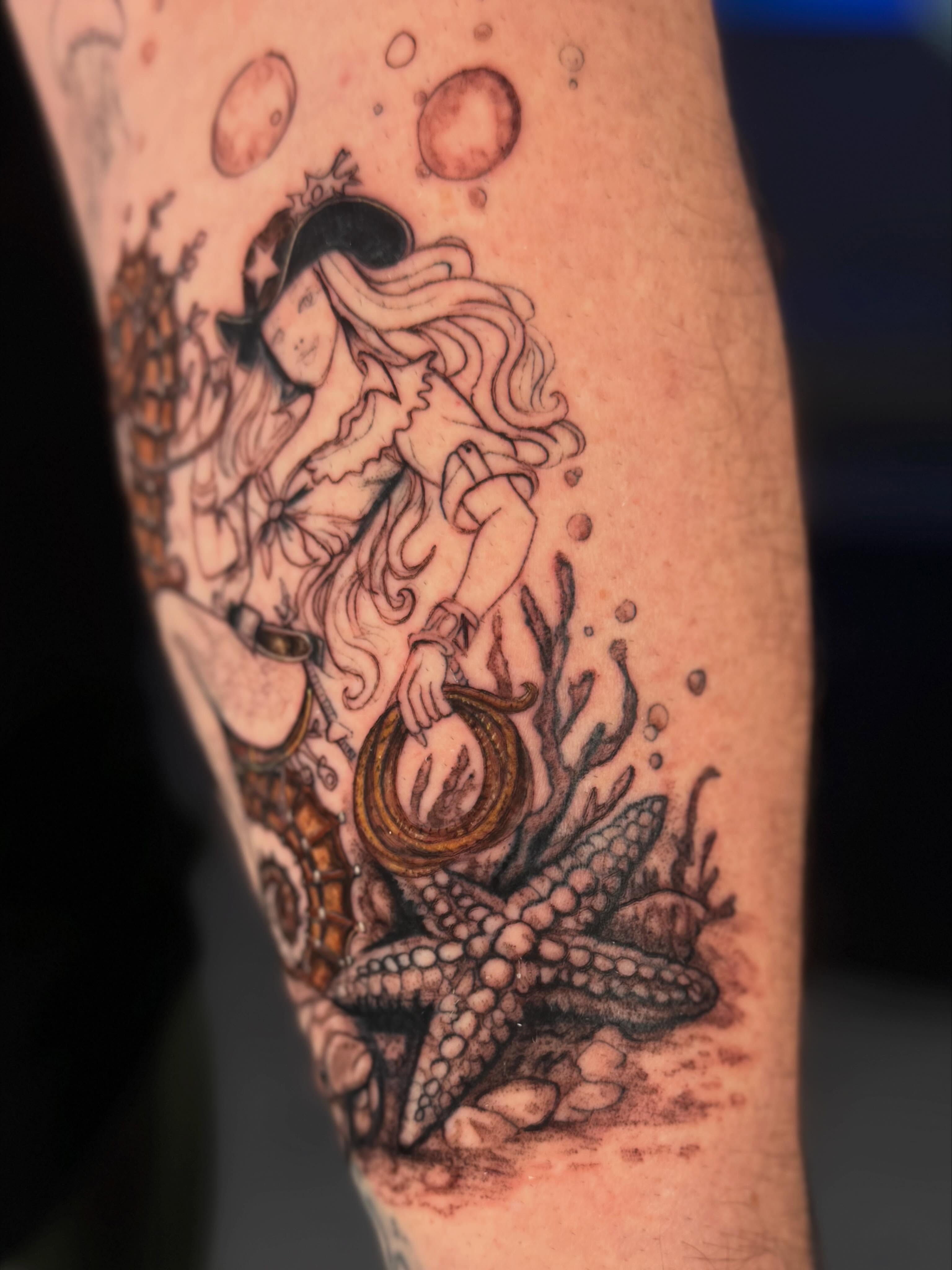 Mermaid and starfish realism tattoo on the forearm by Idalia Pulido
