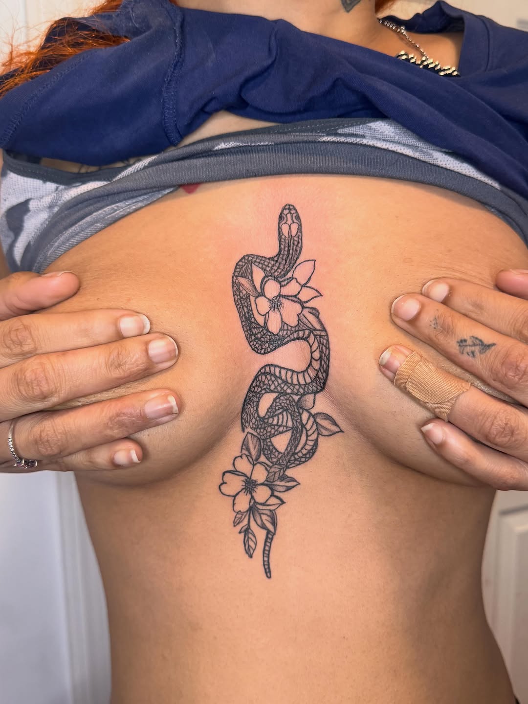 Snake and flowers neo-traditional tattoo on the shoulder by Comet