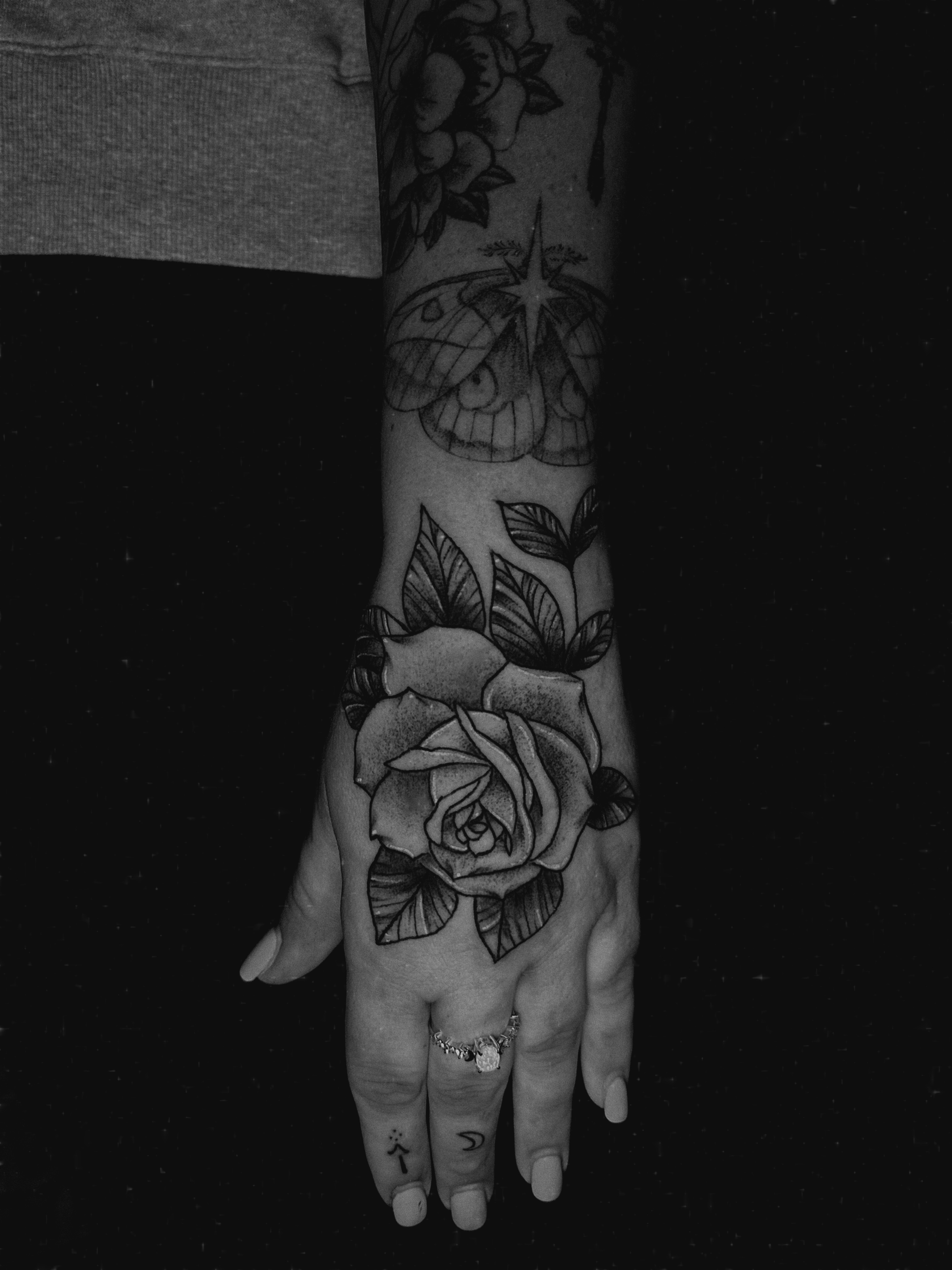 Rose black and grey tattoo on the hand by E L I Z A H B e T H H D e S I G N S