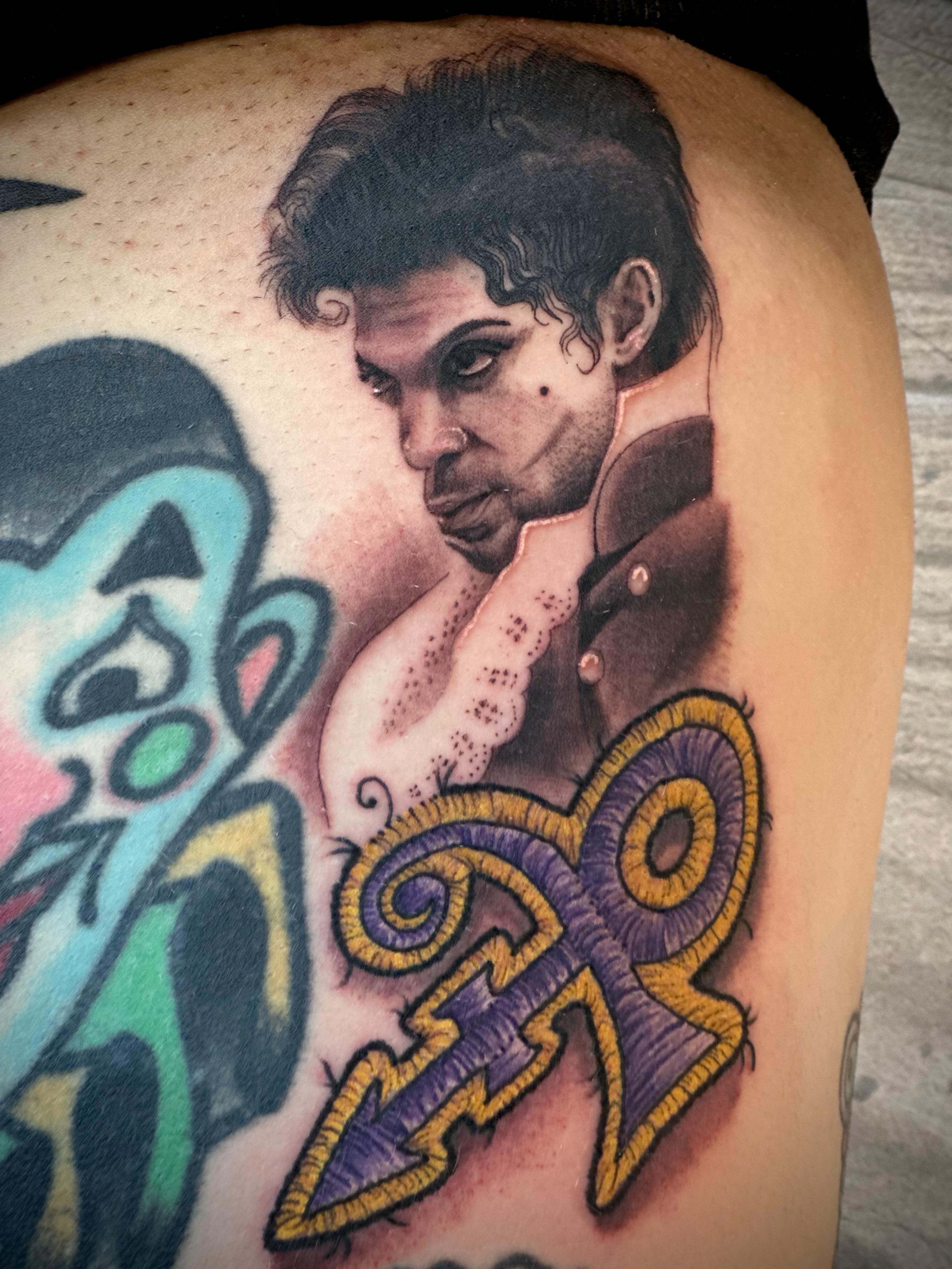 Prince portrait realism tattoo on the thigh by 𝐖𝐄𝐒