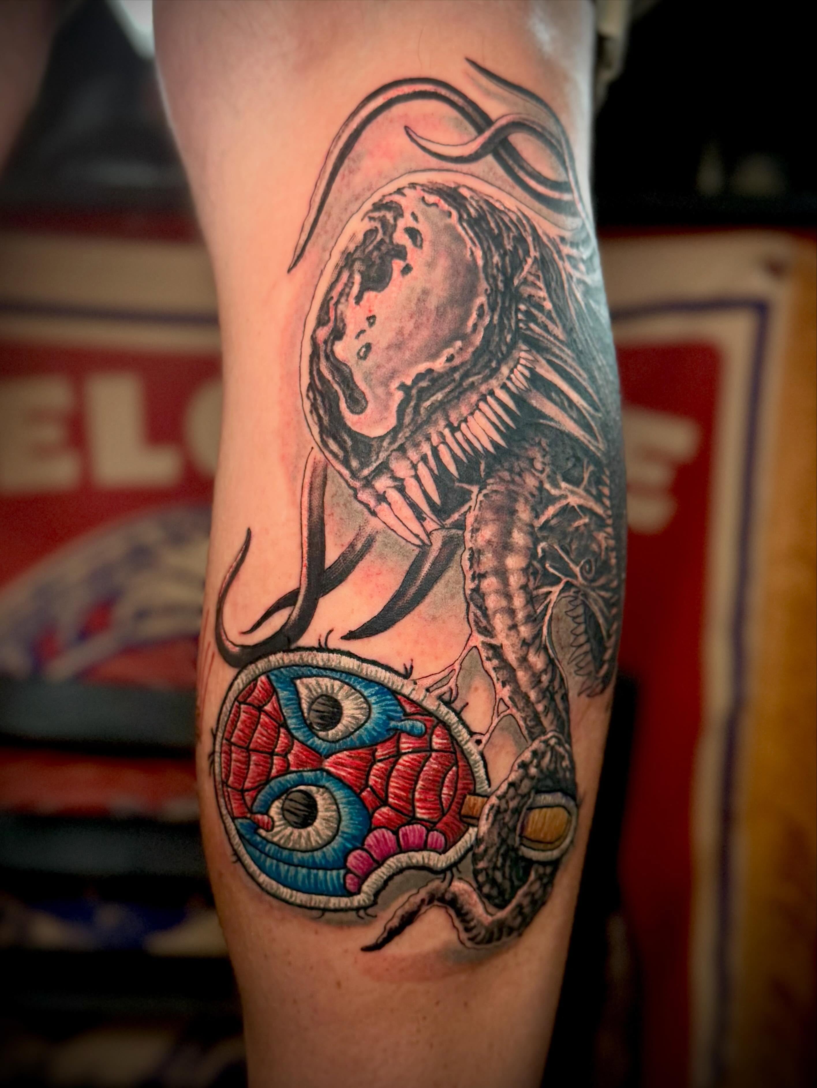 Alien creature dark realism tattoo on the forearm by 𝐖𝐄𝐒