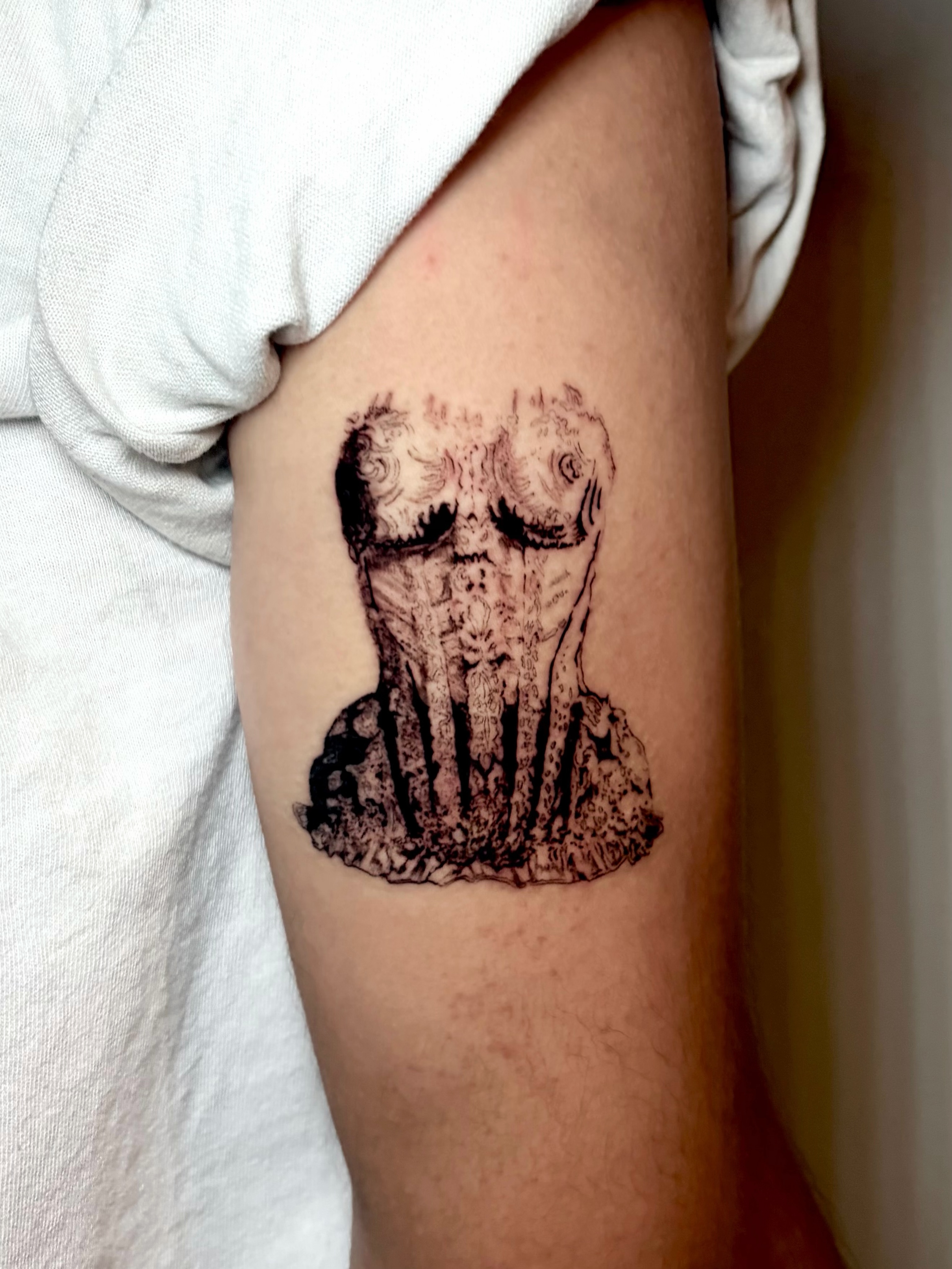 Corset black and grey tattoo on the forearm by Kylah Amin Tattoo