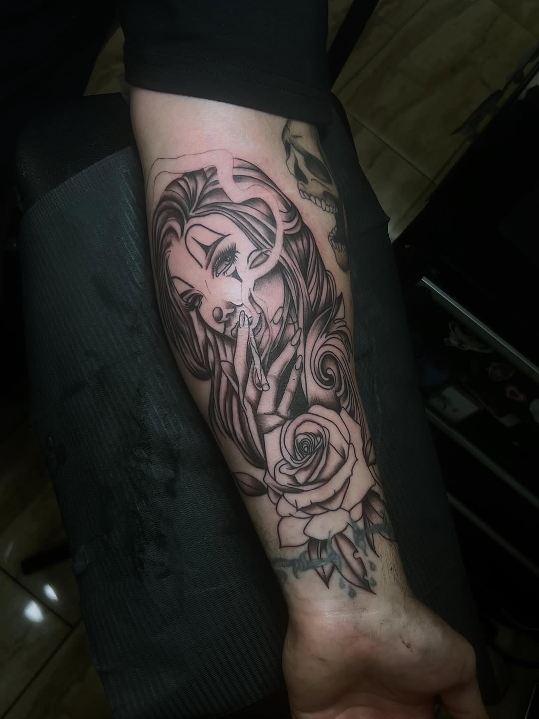 Woman smoking with rose realism tattoo on the forearm by π’ππ΅π΅π΄ π©°π